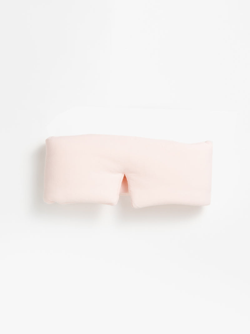 The Cozy Earth Adjustable Bamboo Sleep Mask in Blossom is pictured on a white background.