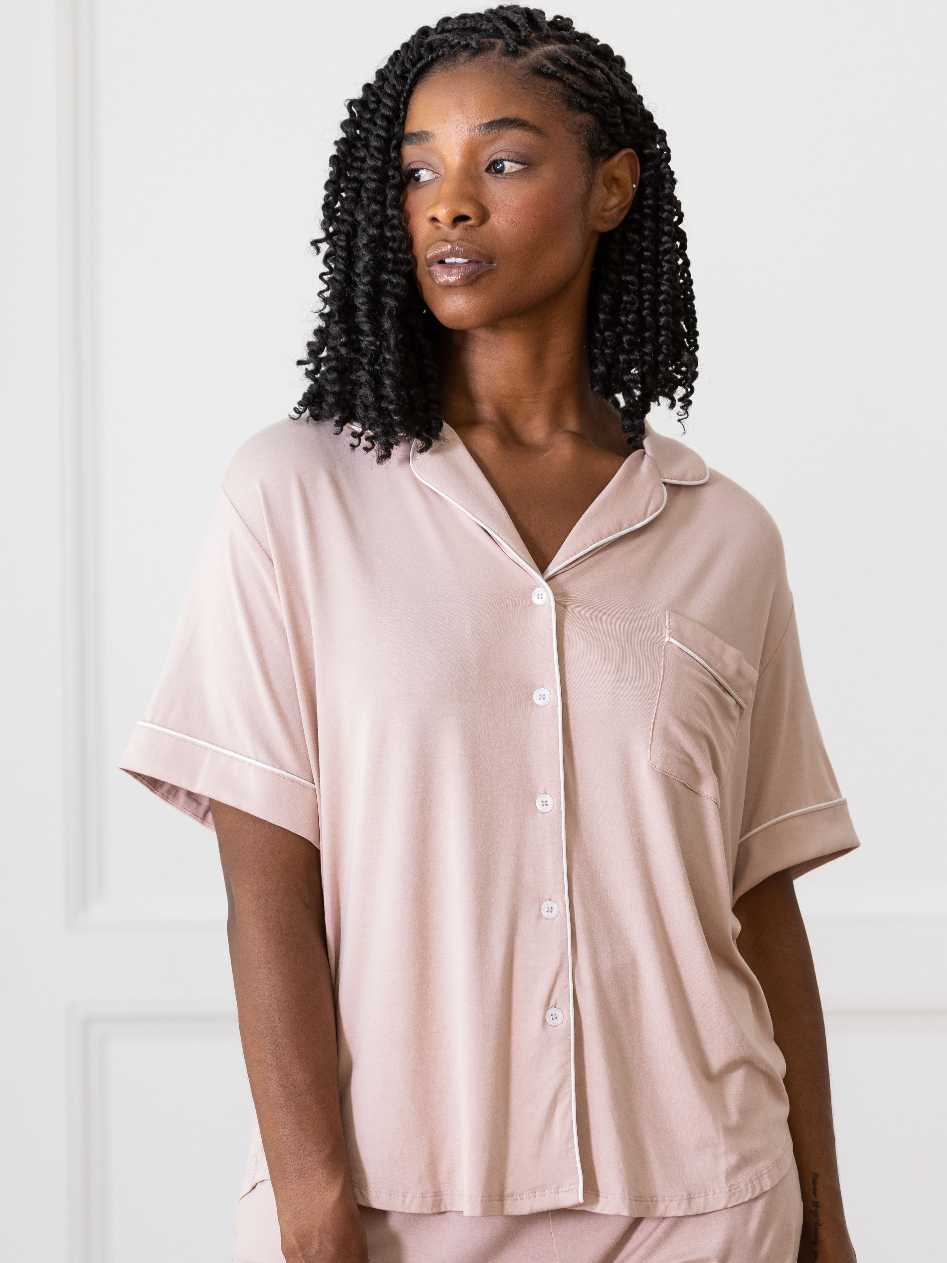 Blush Short Sleeve Pajama Set modeled by a women. The photo was taken in a light setting; showing off the pajamas. |Color:Blush