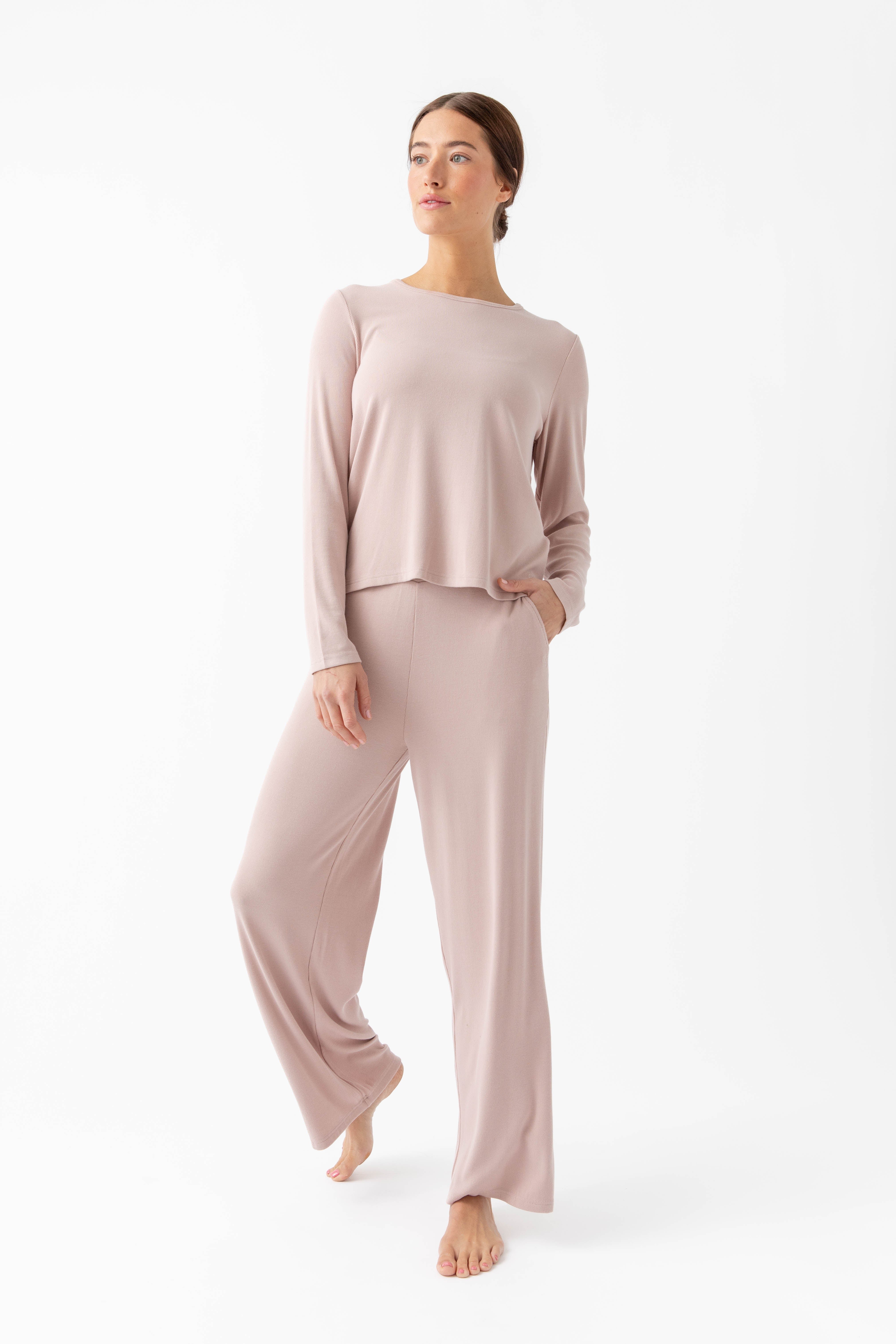 Woman wearing blush rib knit top and pants 