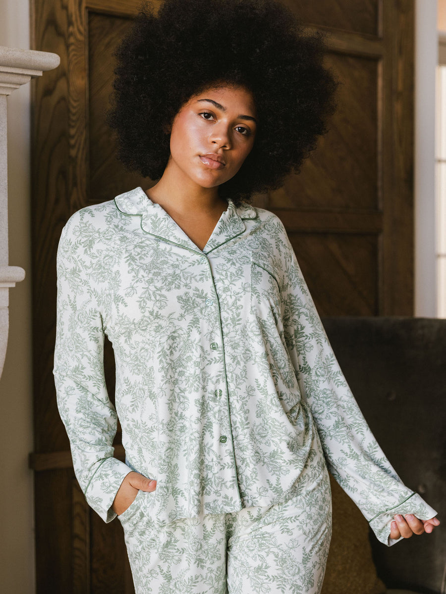 Woman in living room wearing celadon toile pajama shirt |Color:Celadon Toile
