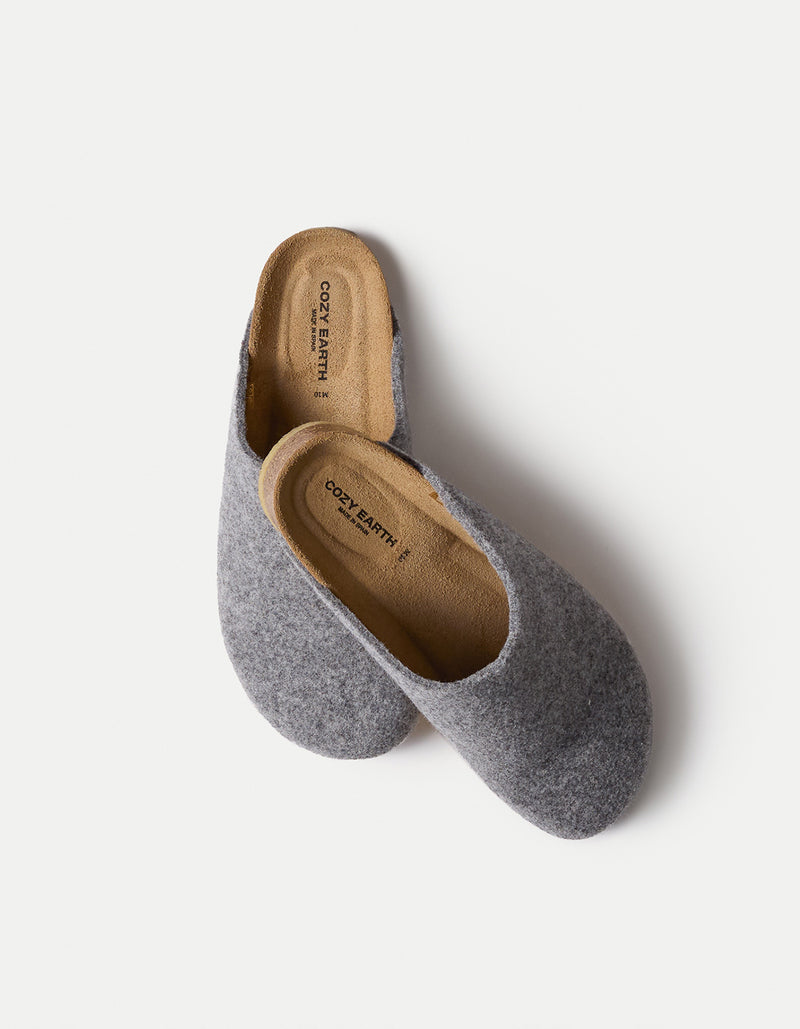 A pair of Lakehouse Clog slip-on slippers by Cozy Earth features a gray, soft-textured fabric exterior and brown insoles, set against a plain light background.