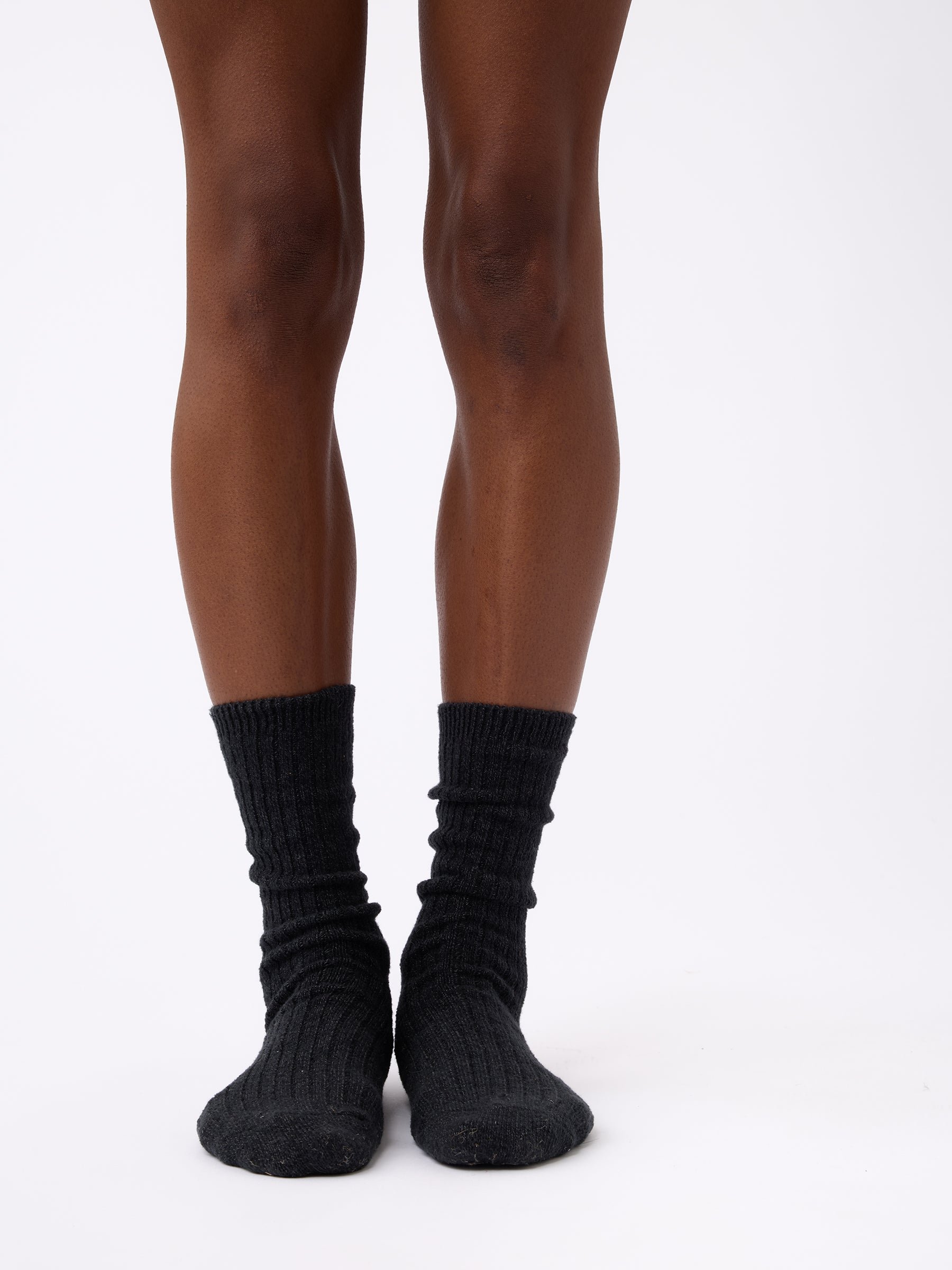 Person wearing Cozy Earth Plush Lounge Sock 3-Pack in Charcoal 