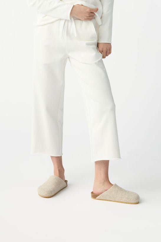 A person pictured from the waist down wearing Cozy Earth Women's Chelsea Cropped Pant in Bone 