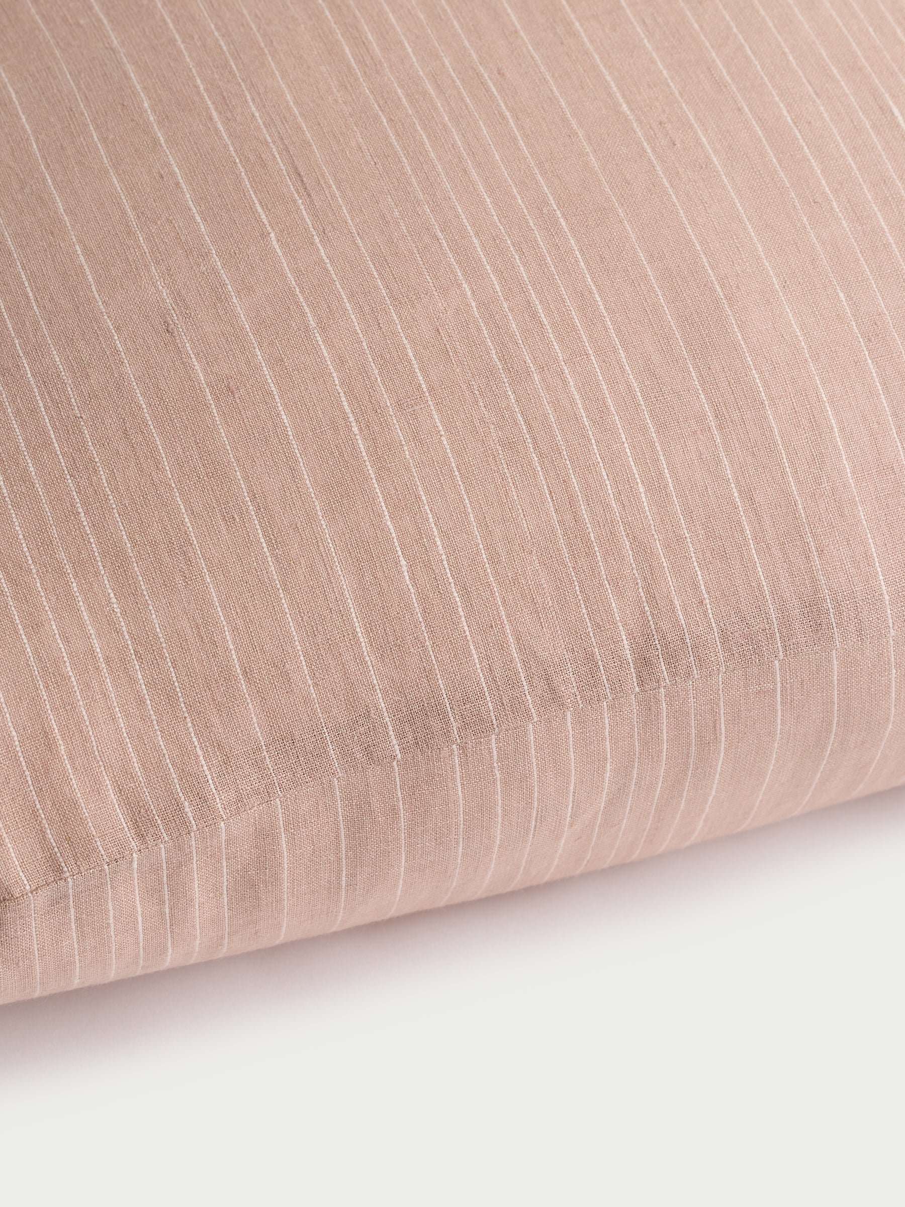 Cozy Earth striped throw pillow with plain white background 