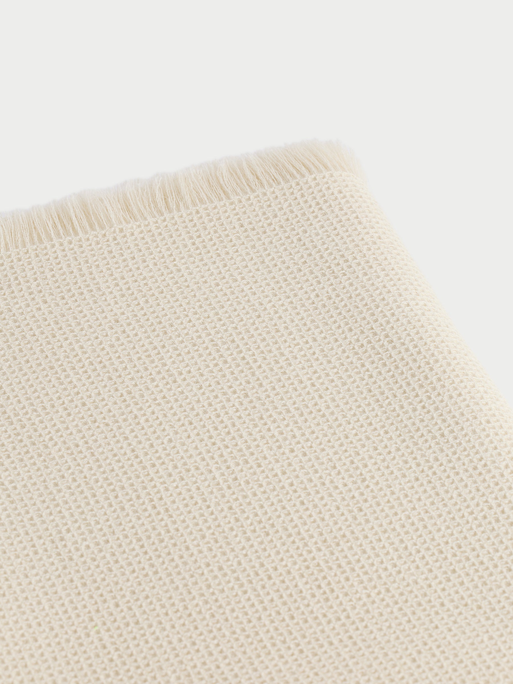 Corner of creme alpaca throw with white background |Color:Creme