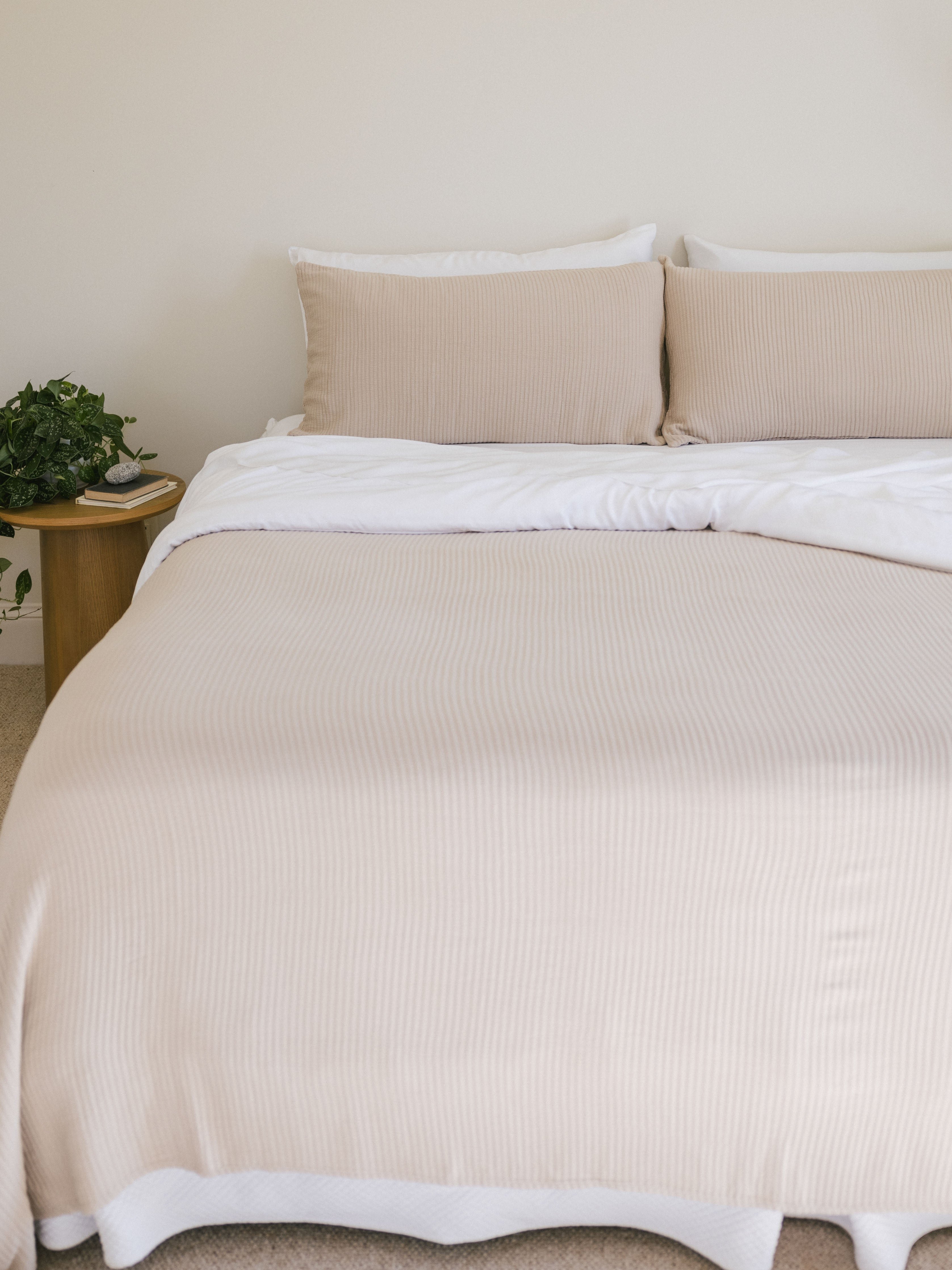 Driftwood coverlet and shams on a bed 