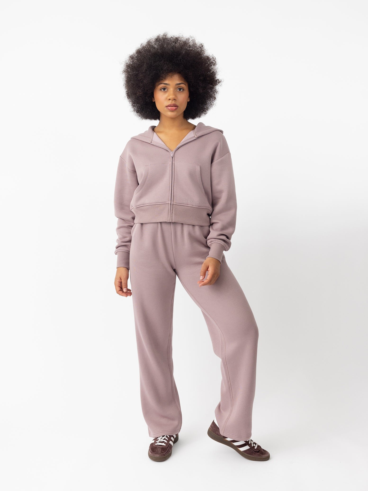 Woman wearing Dusty Orchid CityScape Cropped Full Zip with white background 