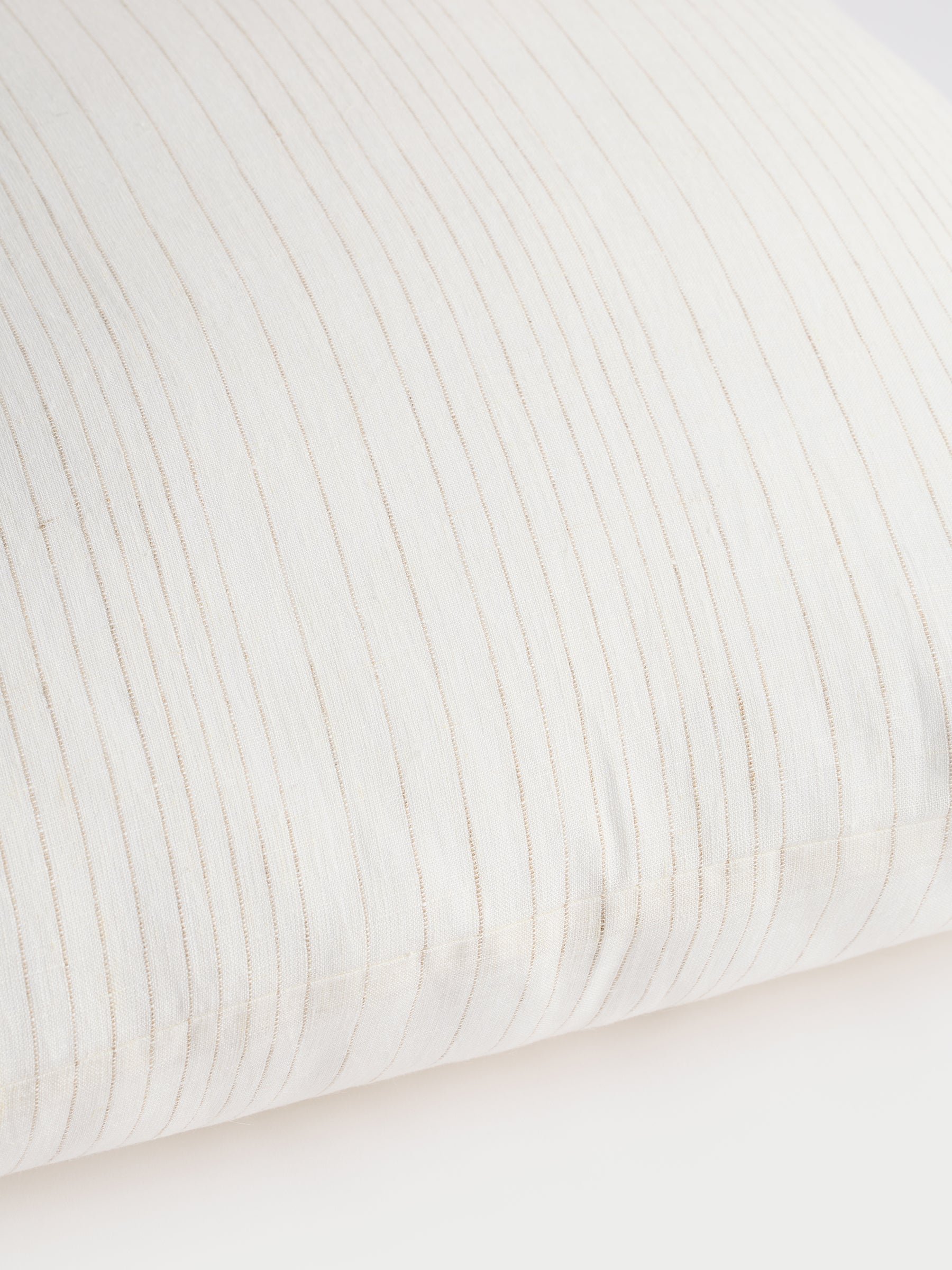 Cozy Earth striped throw pillow with plain white background 