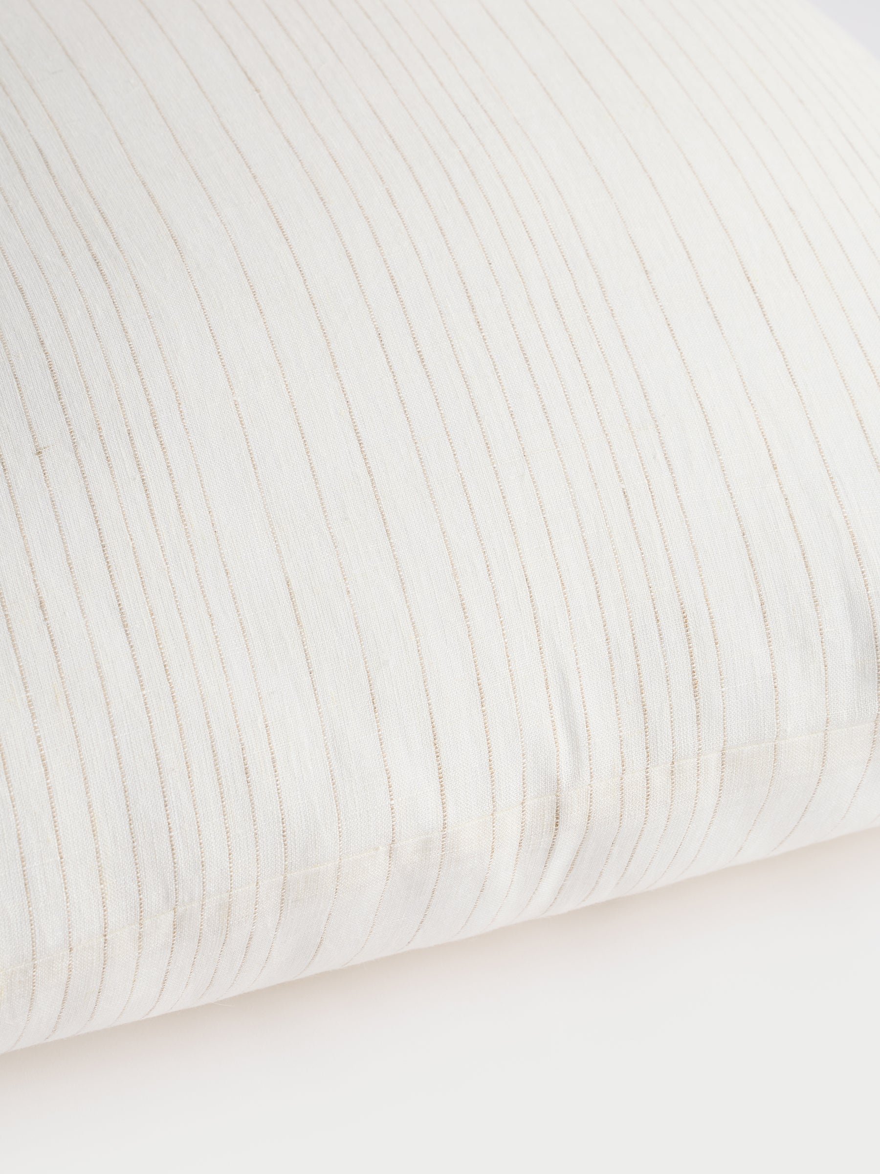 Cozy Earth striped throw pillow with plain white background 