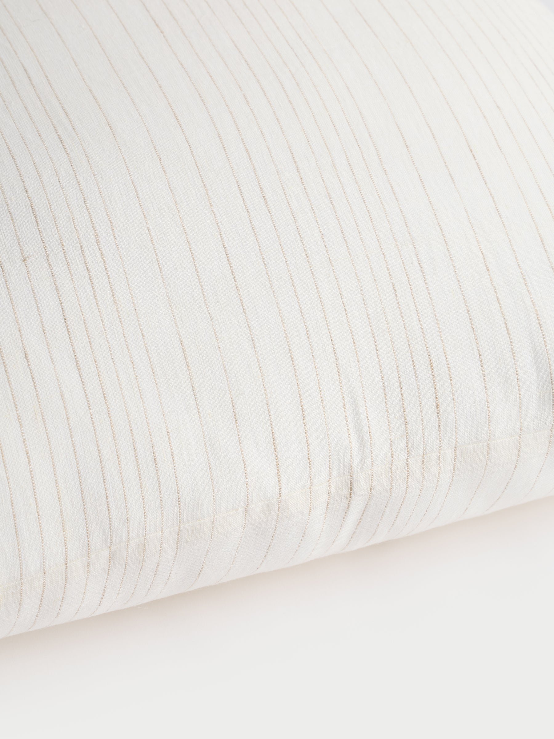 Cozy Earth striped throw pillow with plain white background 