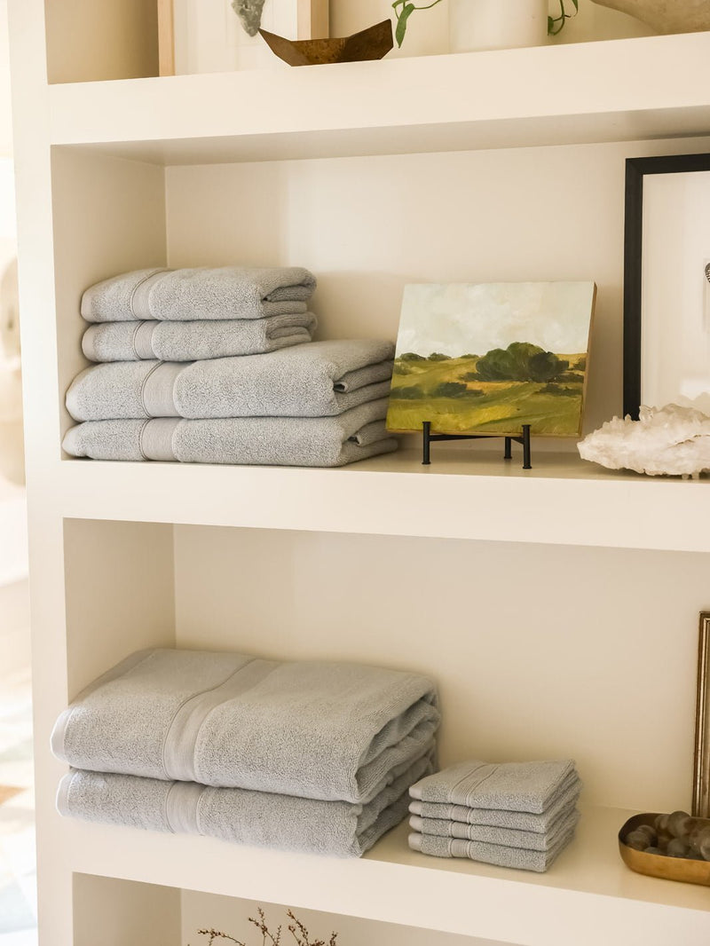 Collection of harbor mist luxe towels on shelves