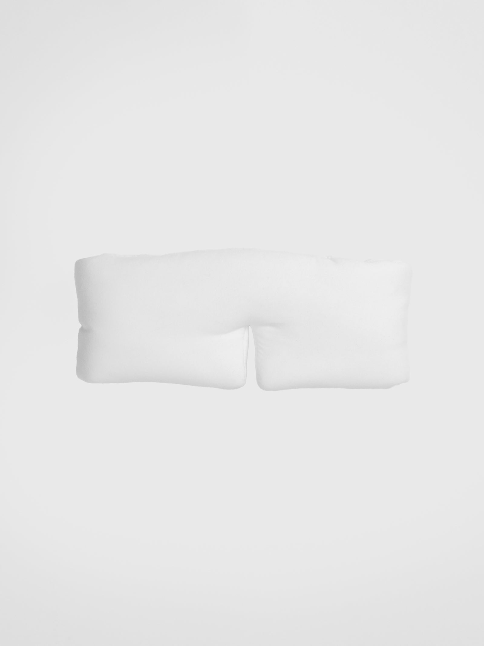 The Cozy Earth Adjustable Bamboo Sleep Mask in Ivory is pictured on a white background. 