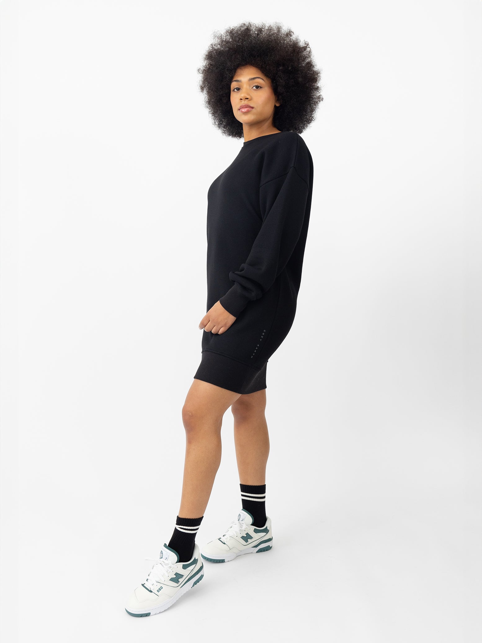 Woman wearing Black CityScape Crewneck Dress with white background 
