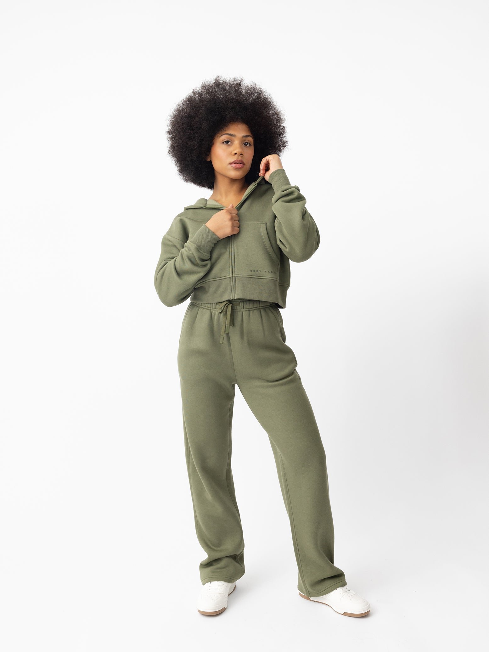 Woman wearing Juniper CityScape Cropped Full Zip with white background 