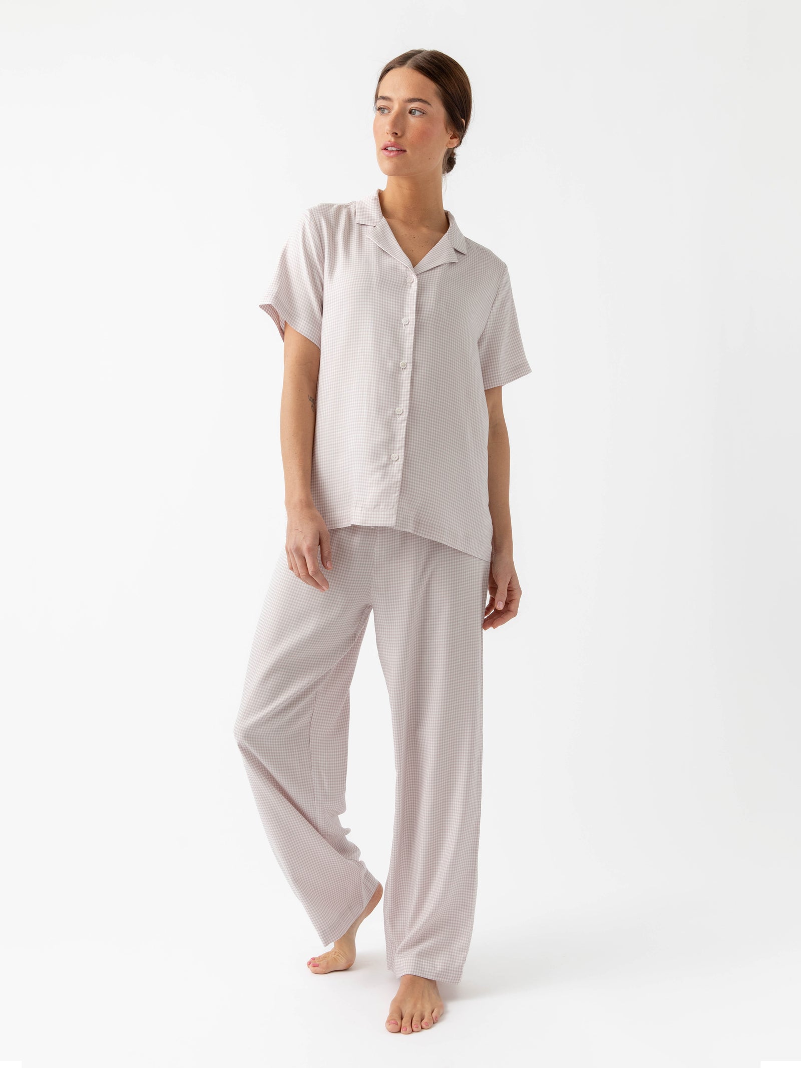 Woman in Lavender Mini Gingham soft woven pajama set with white background 