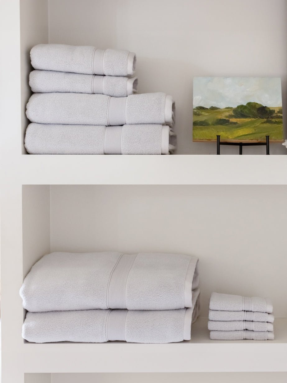 Complete luxe bath bundle folded on shelves 