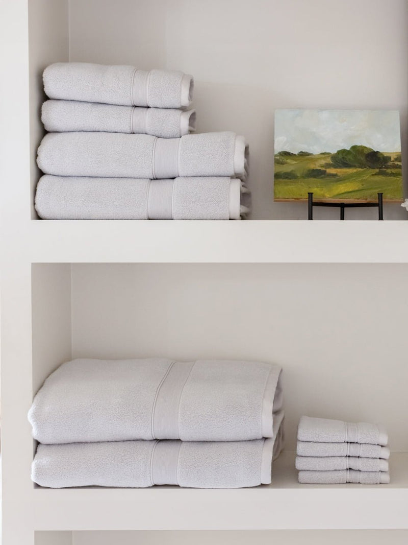 Complete luxe bath bundle folded on shelves