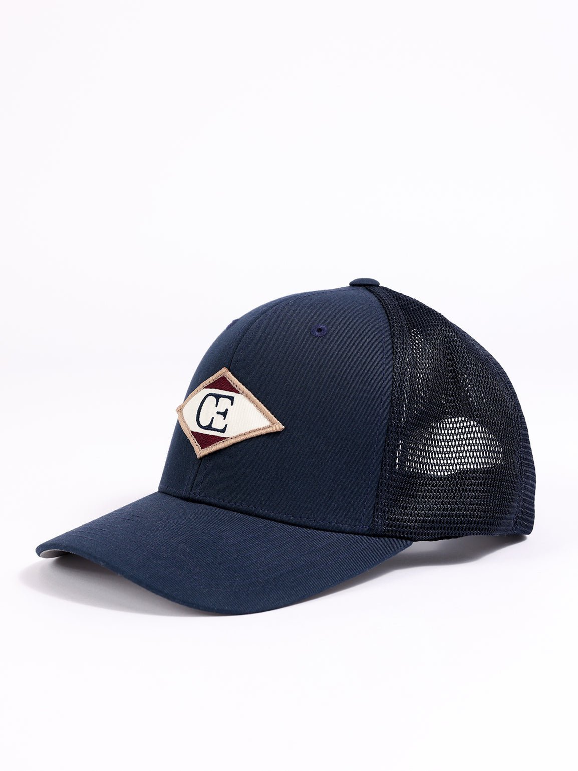 Side view of navy diamond mesh trucker hat 