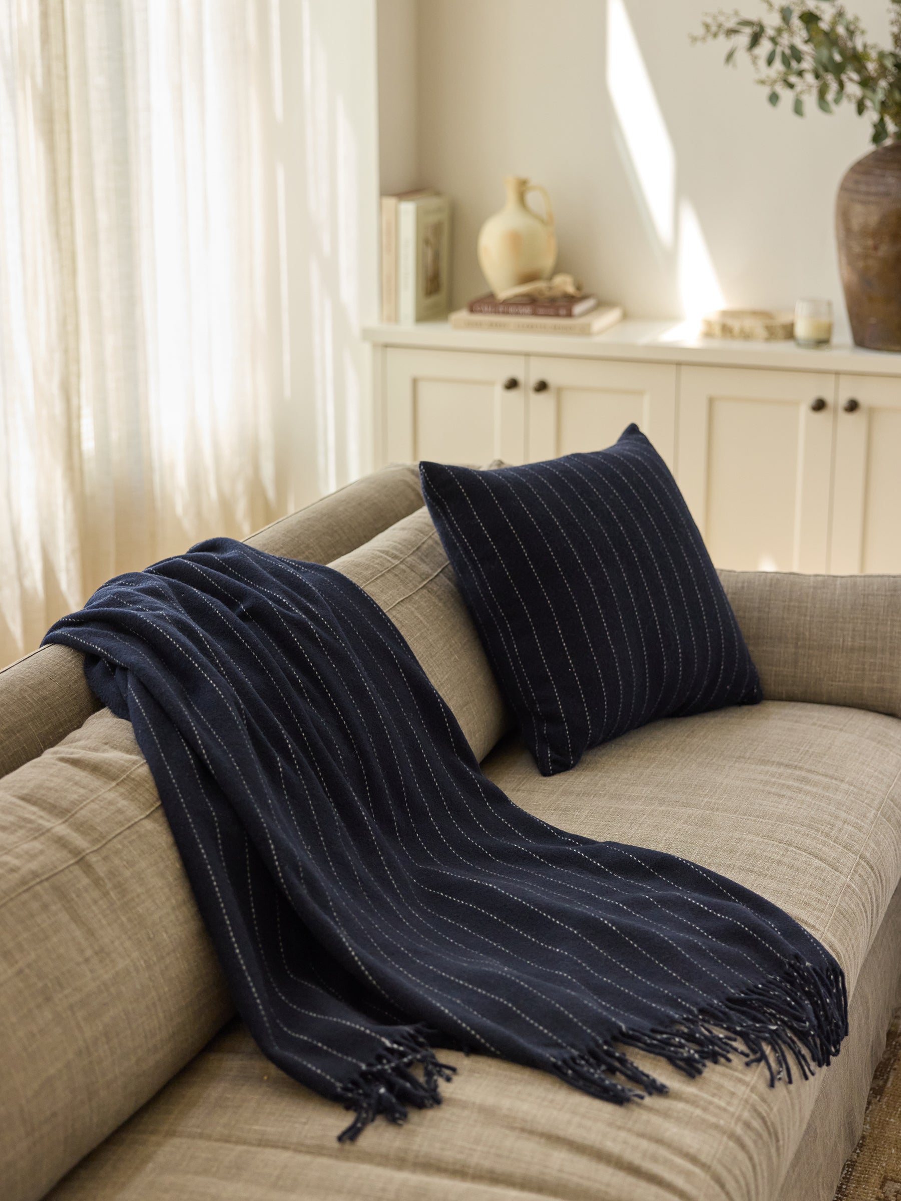 Florence pillow and blanket rested on sofa |Color:Navy