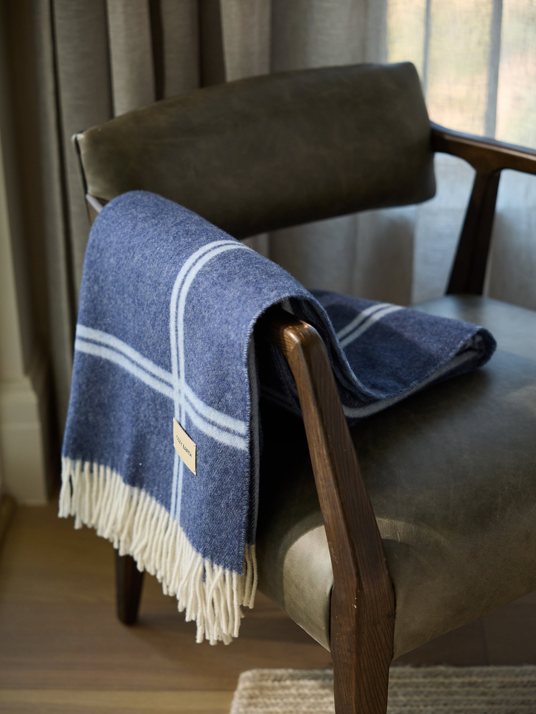 Navy cortina throw draped over accent chair |Color:Navy/Sky