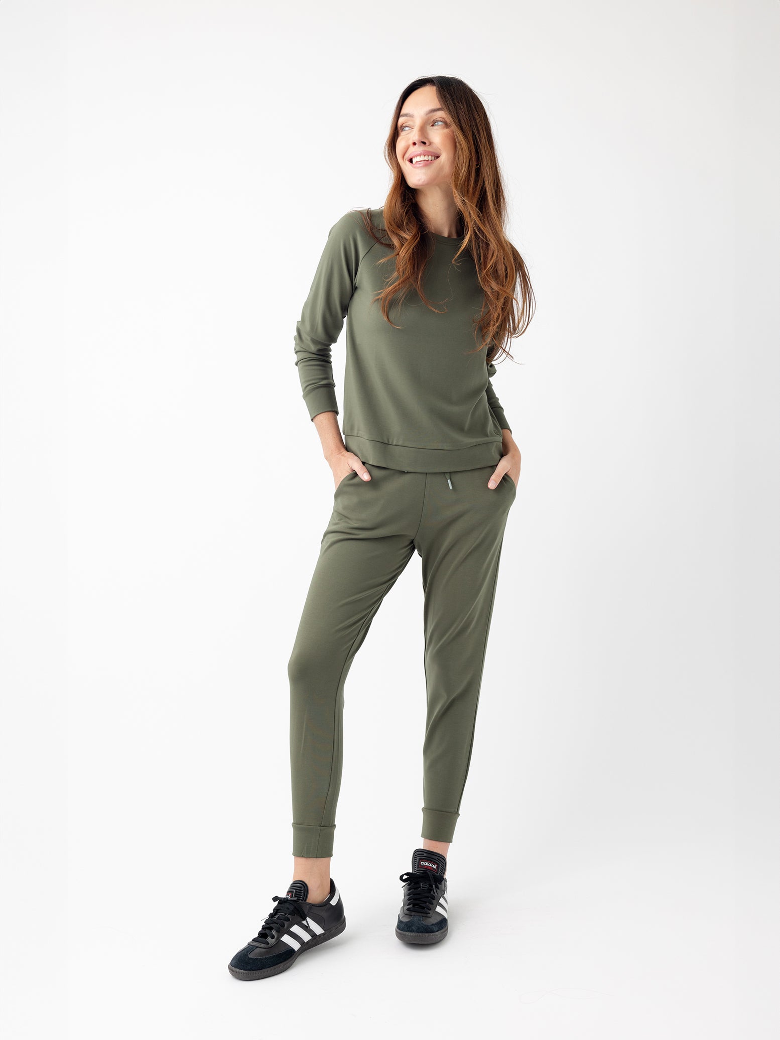 Woman in olive jogger set with white background 