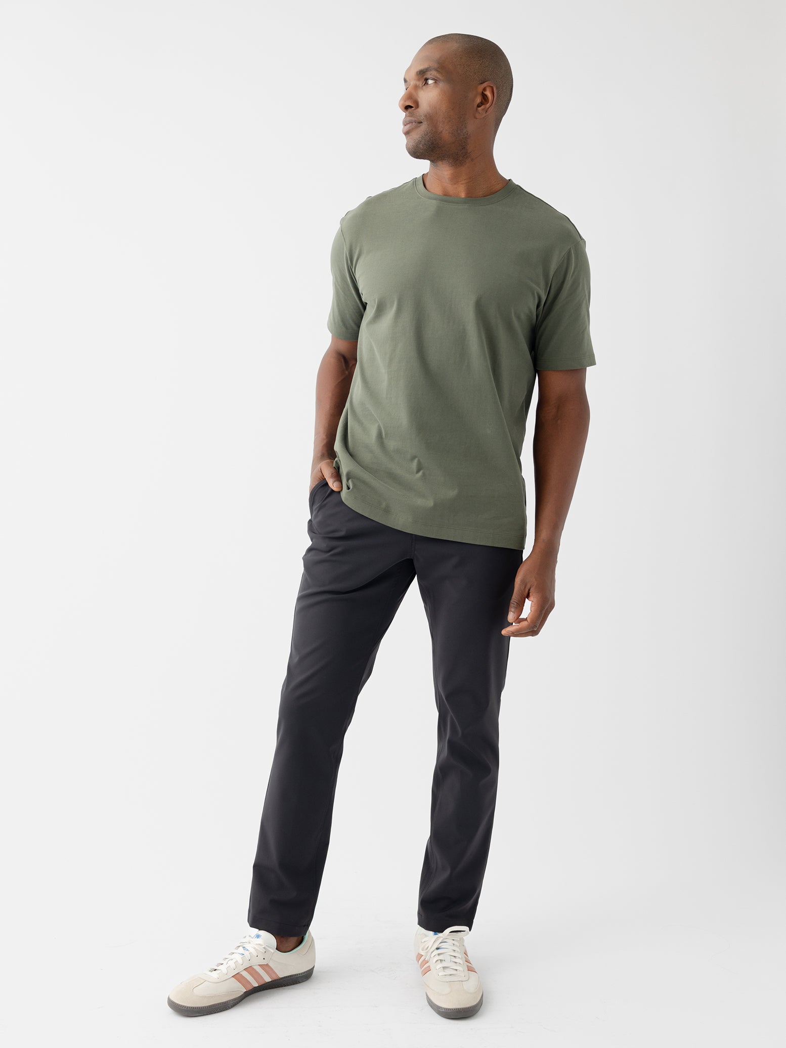 Man in olive tee and black pants with white background |Color:Olive