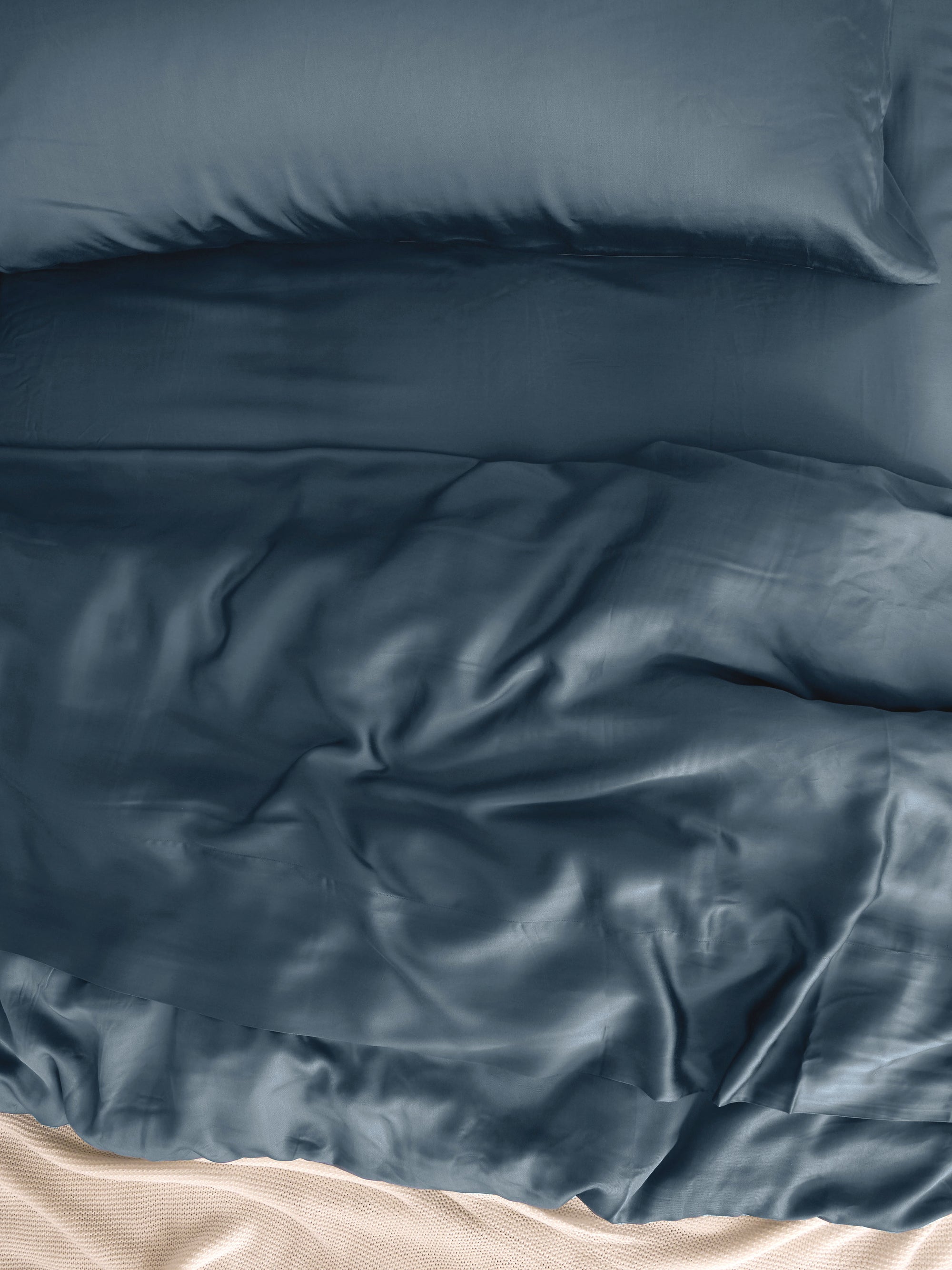 Close up of pacific blue bedding on a bed standard/king/body 