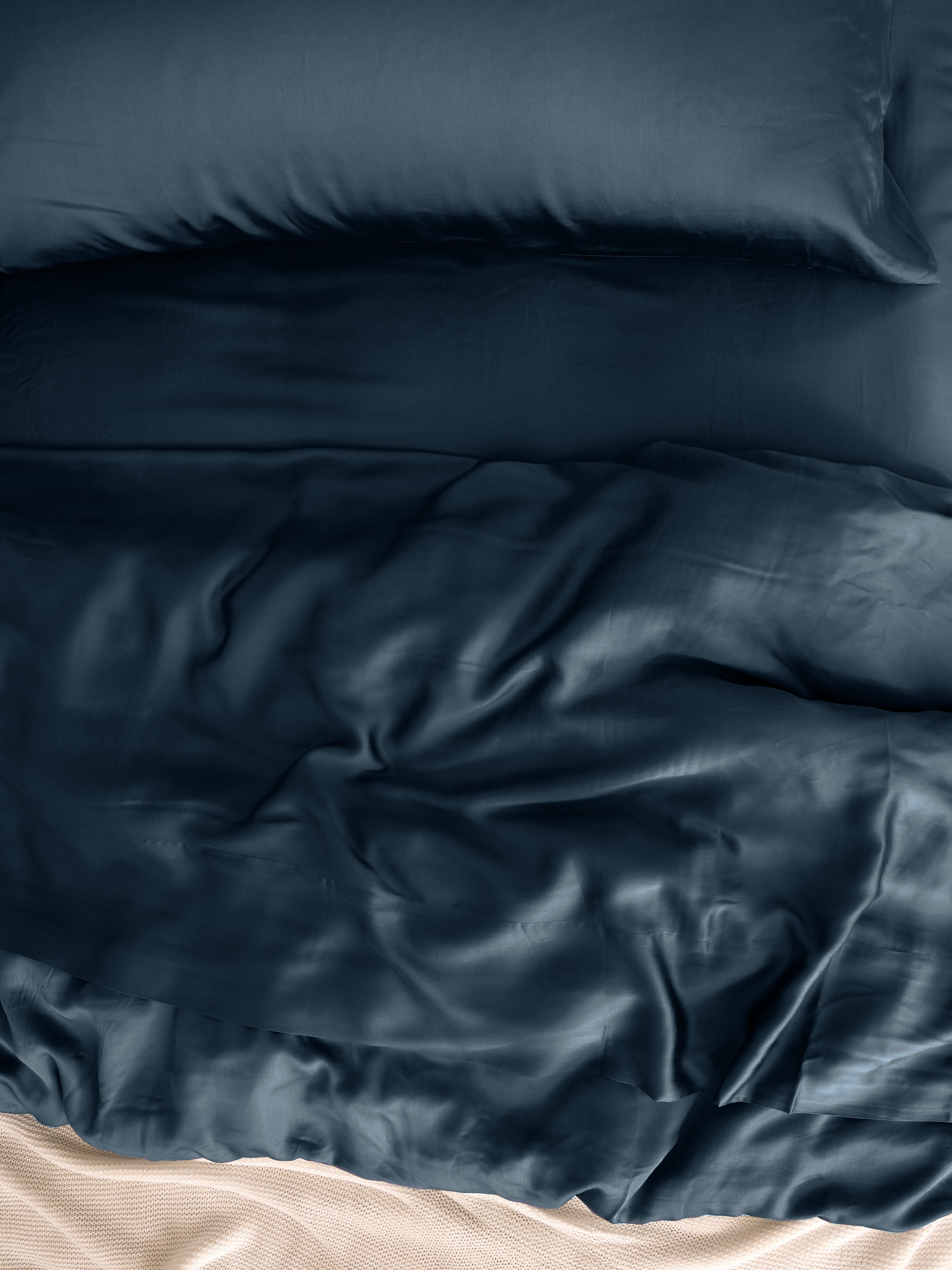 Close up of pacific blue bedding on bed 