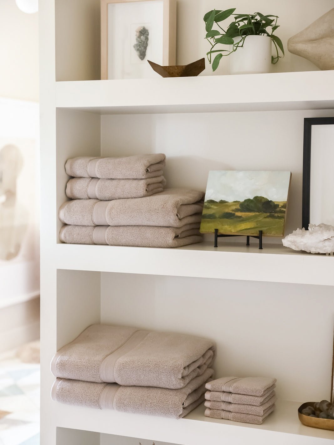 Complete luxe bath bundle folded on shelves 