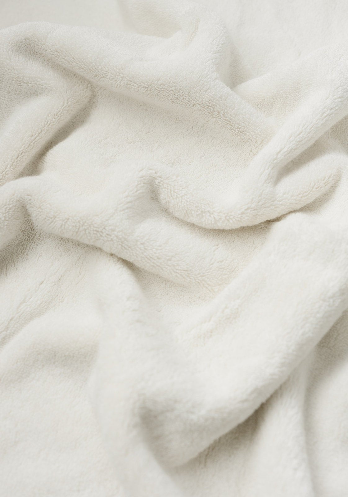 Premium Plush Bath Towel in the color Sea Shell. Photo of Sea Shell Premium Plush Bath Towel taken as a close up only showing the Premium Plush Bath Towel |Color:Sea Shell