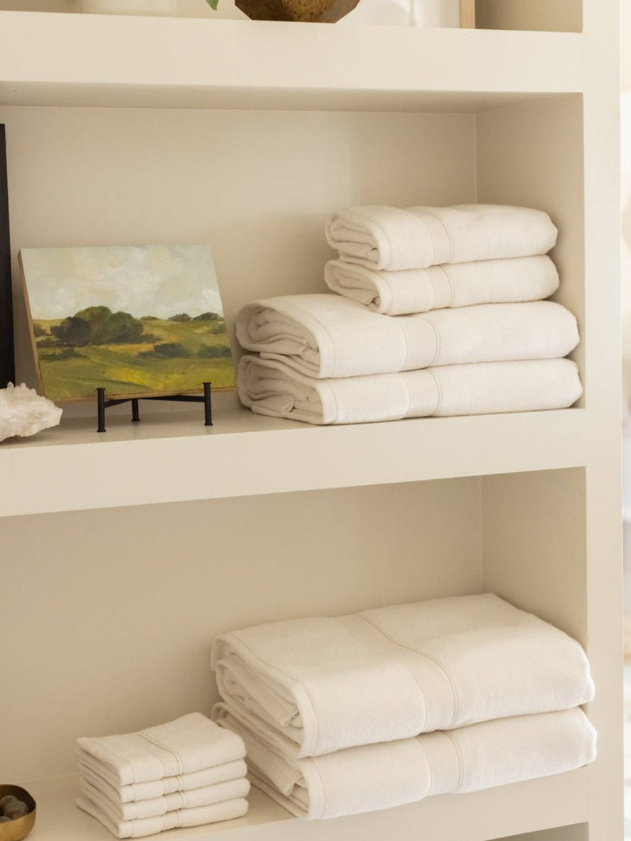 Complete luxe bath bundle folded on shelves |Color:Seashell