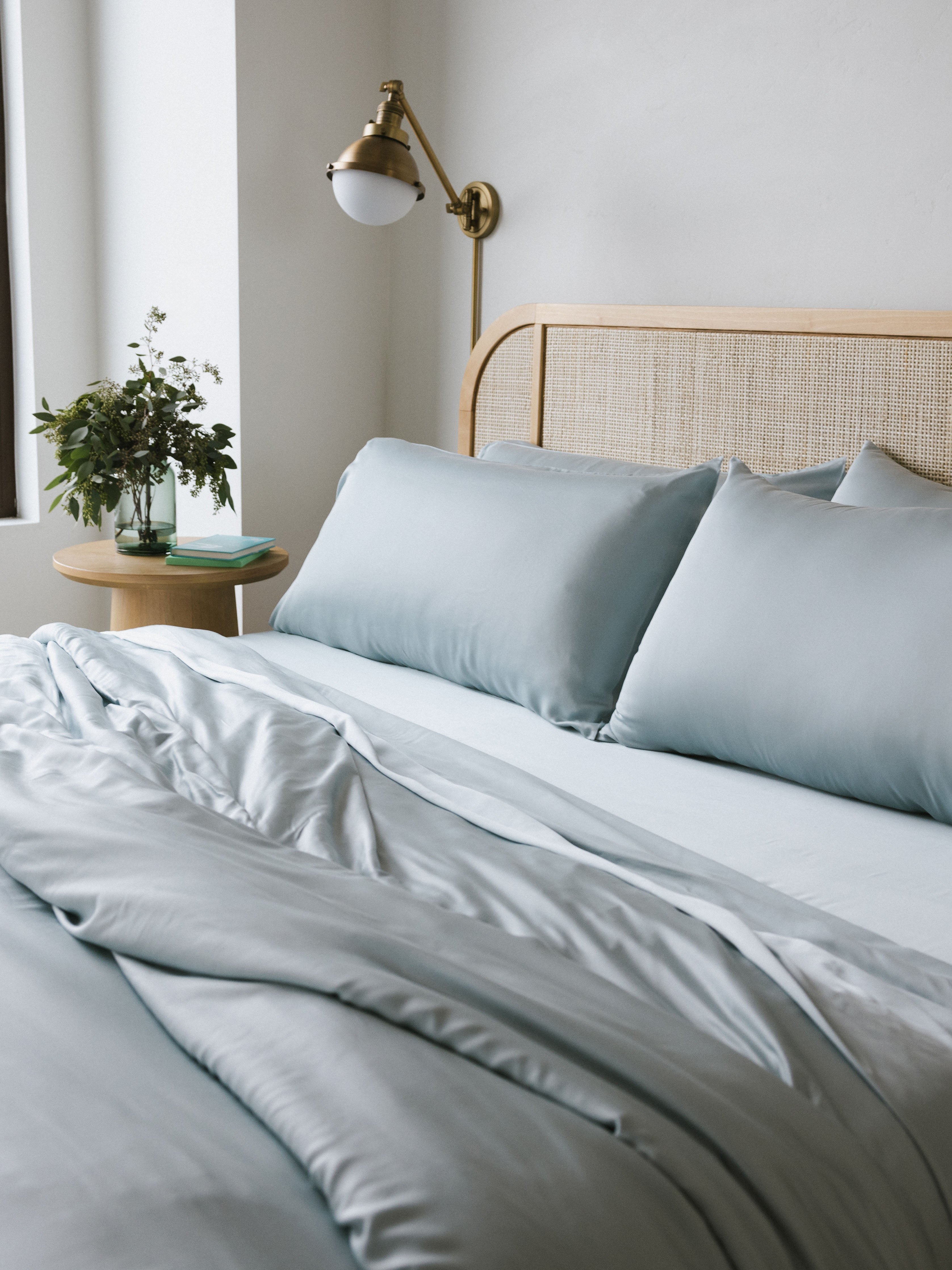 Partially made bed with shore bedding 