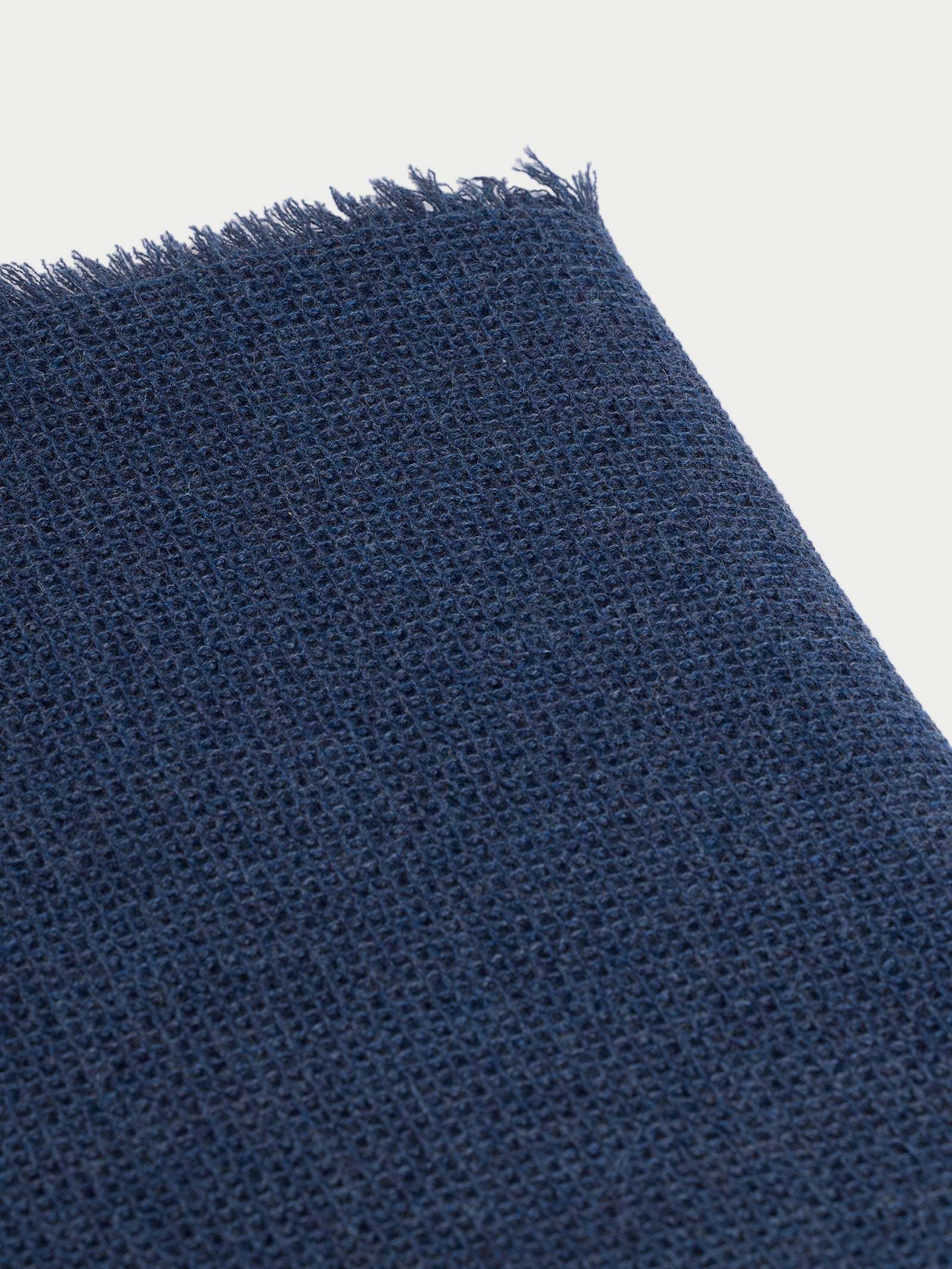 Corner of slate blue alpaca throw 