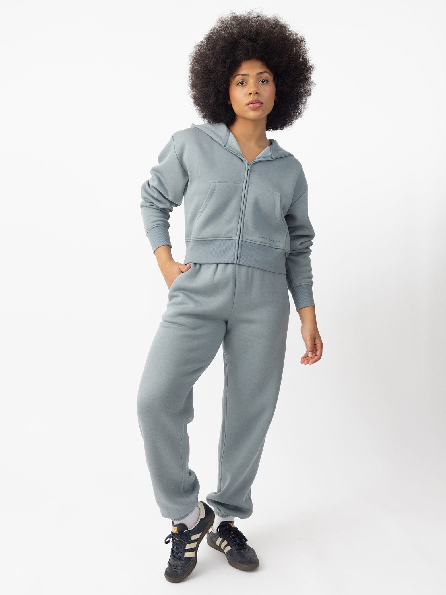  Woman wearing Smokey Blue  CityScape Cropped Full Zip with white background 