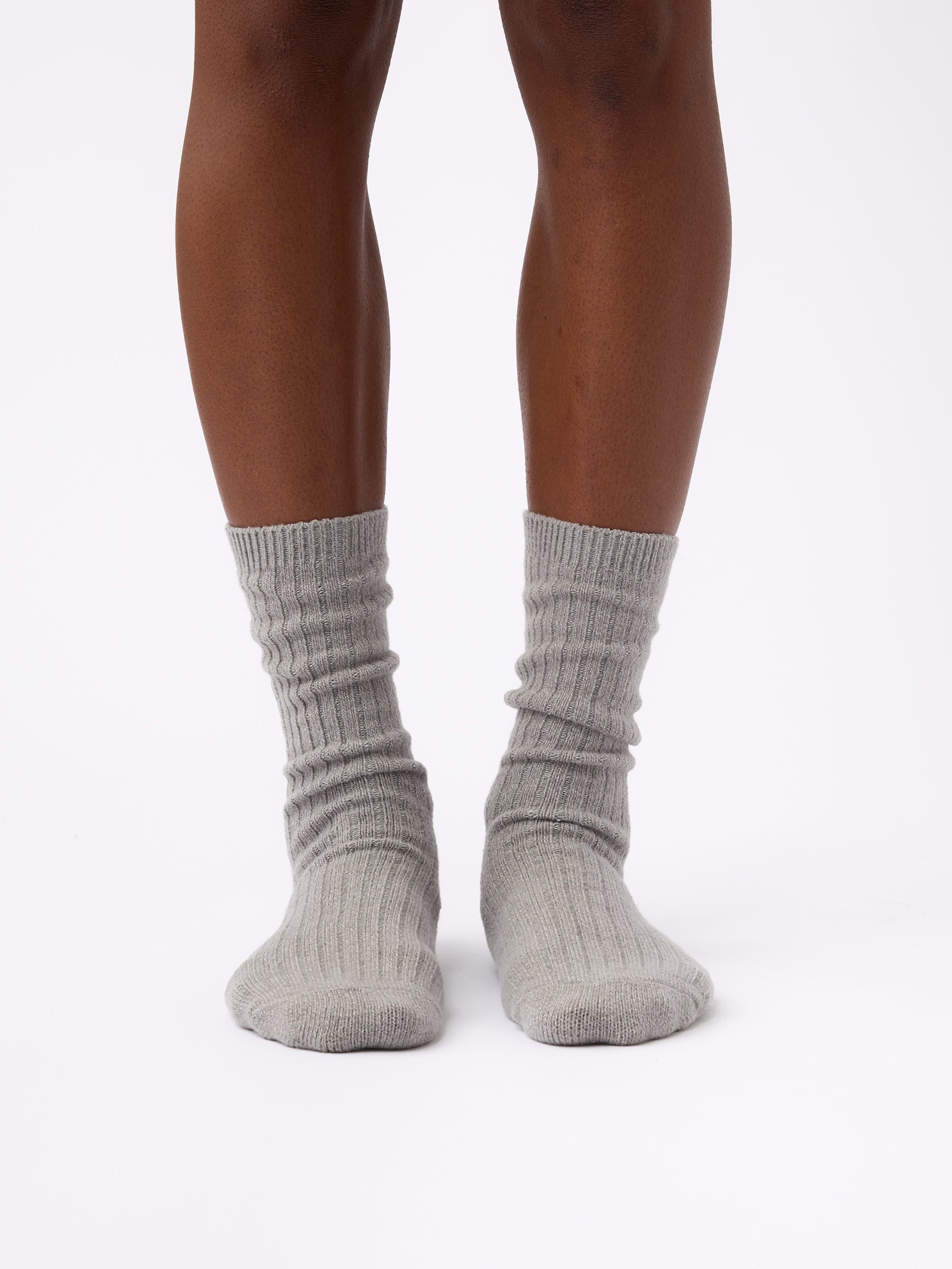 Person wearing Cozy Earth Plush Lounge Calf Sock 1-Pack in Stone 