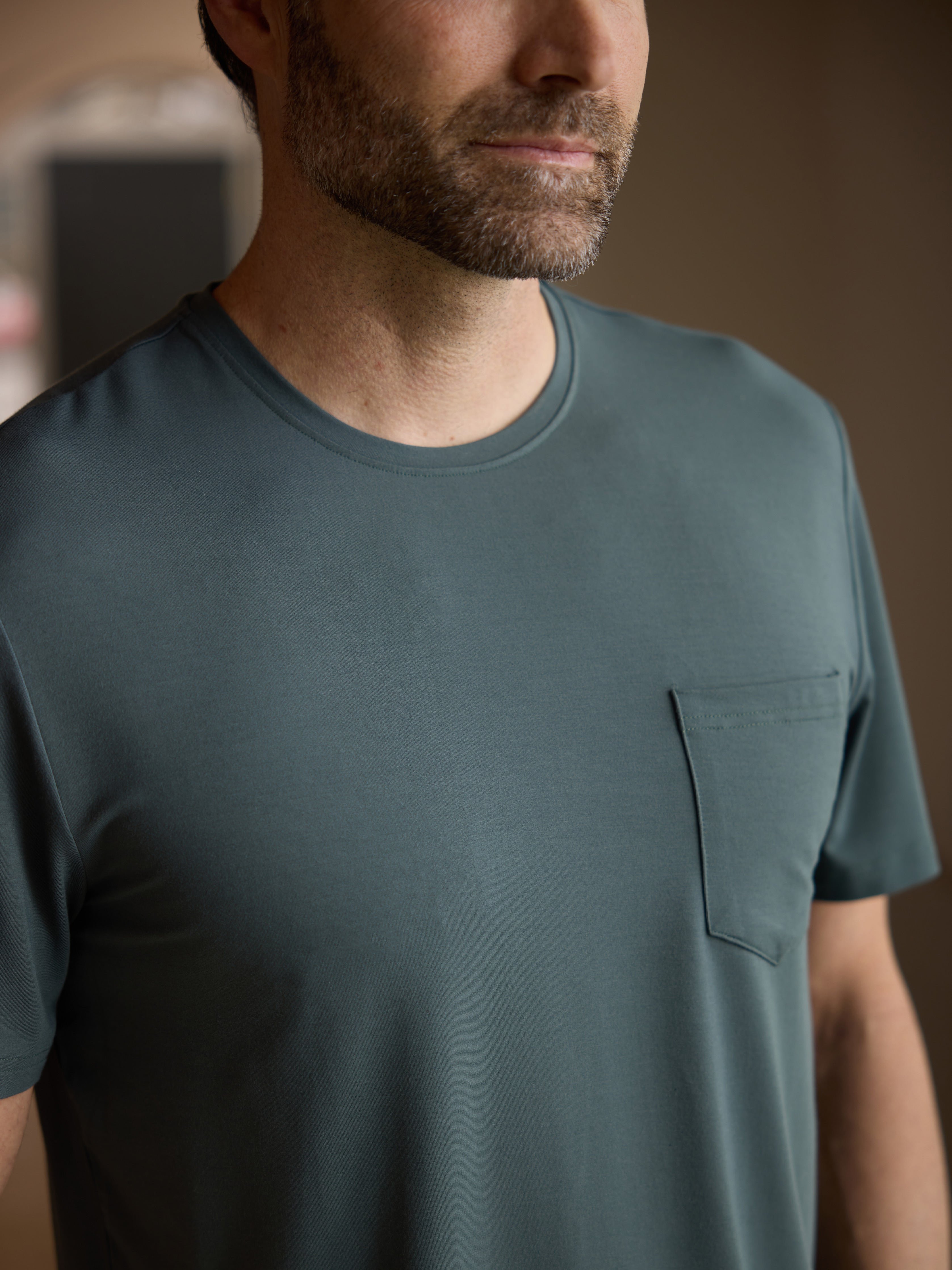 Close up of man wearing storm pajama shirt 