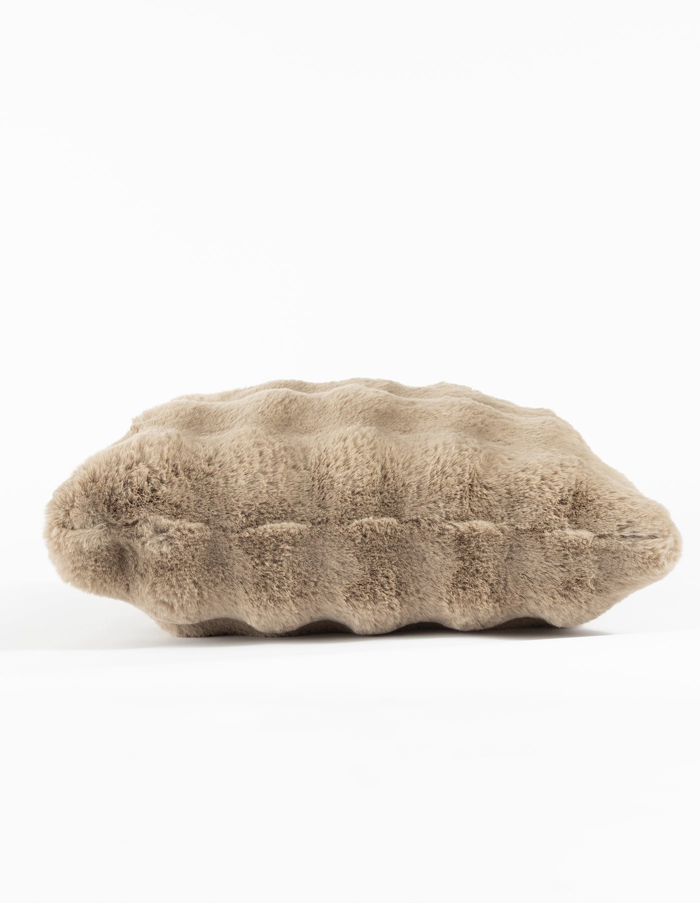 A beige Bubble Cuddle Pillow by Cozy Earth, featuring a ribbed, wavy texture, lies flat against a white background. Its plush and soft appearance is highlighted by its undulating design. |Color:Walnut