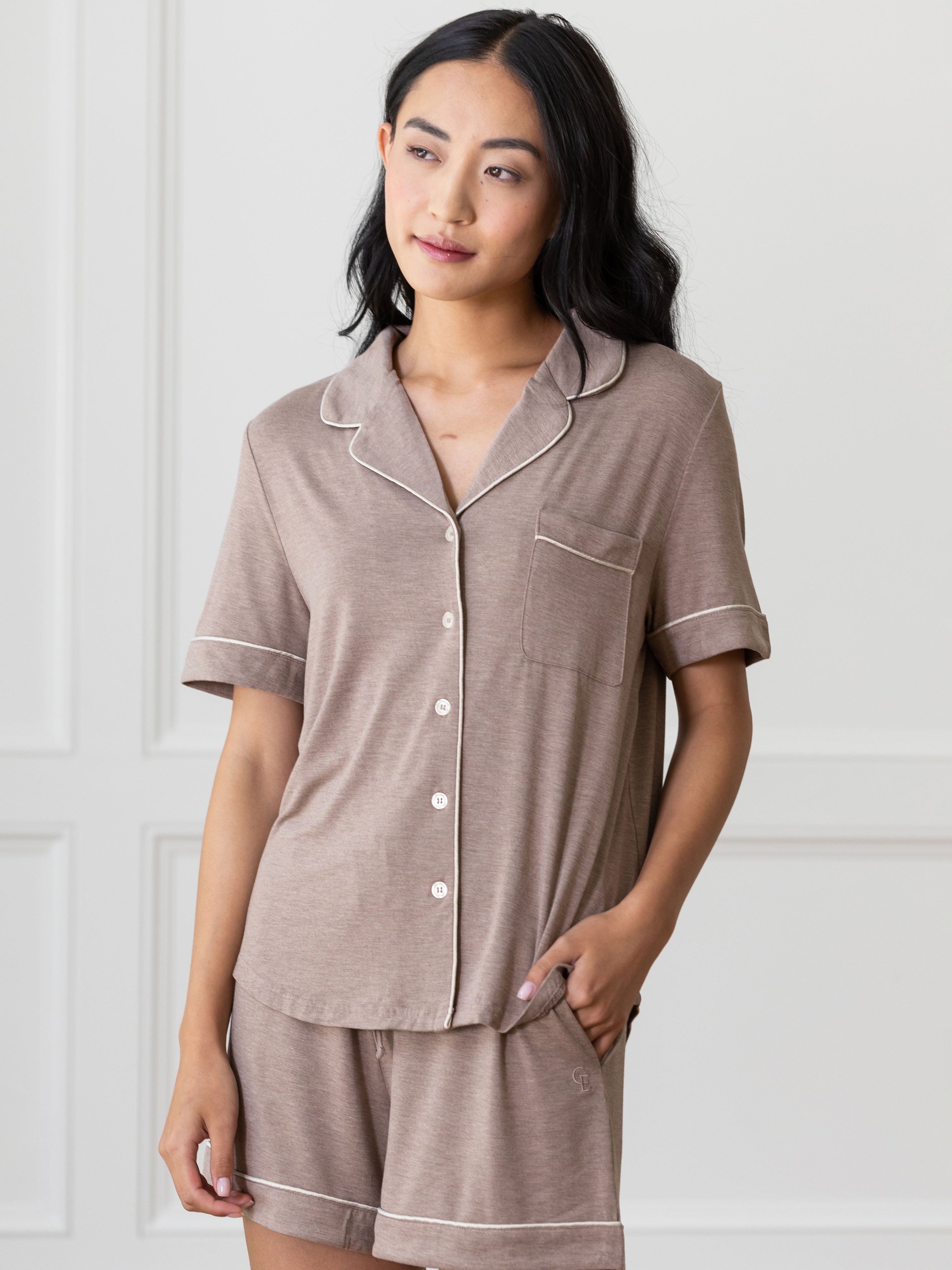 Walnut Short Sleeve Pajama Set modeled by a women. The photo was taken in a light setting; showing off the pajamas. 