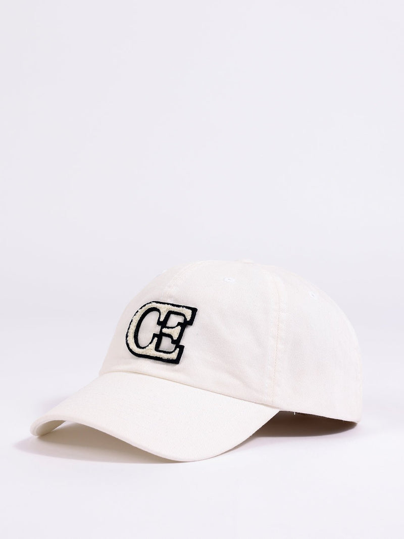 Side view of washed cream vintage cap