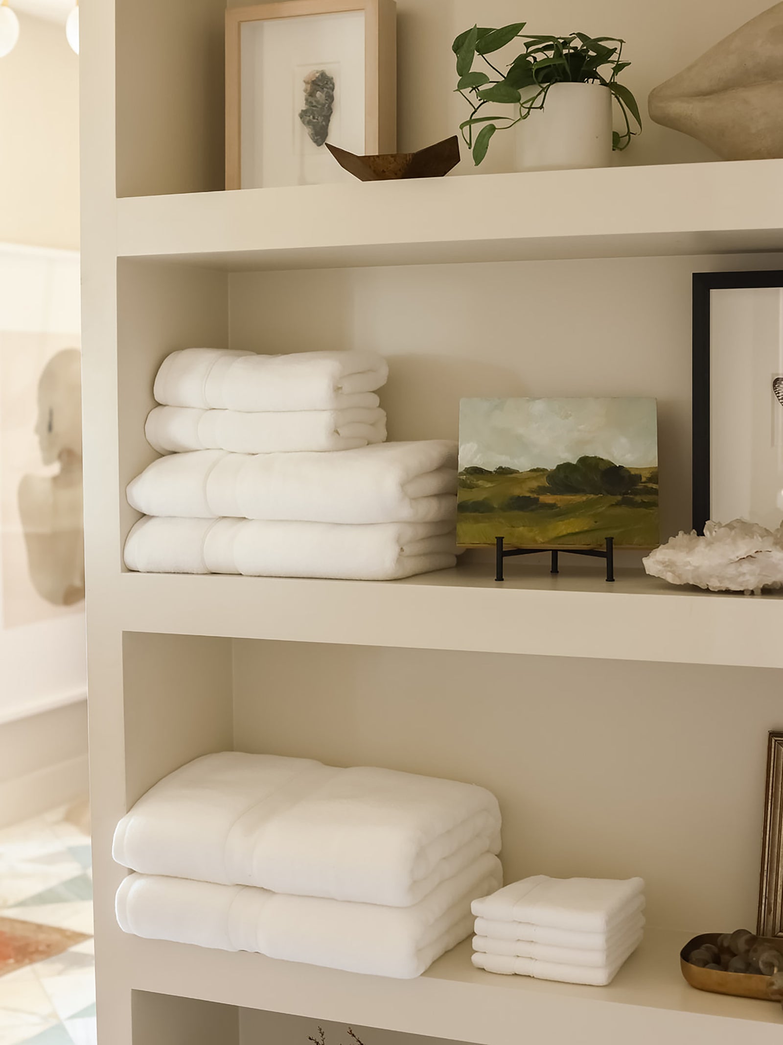 Complete luxe bath bundle folded on shelves 