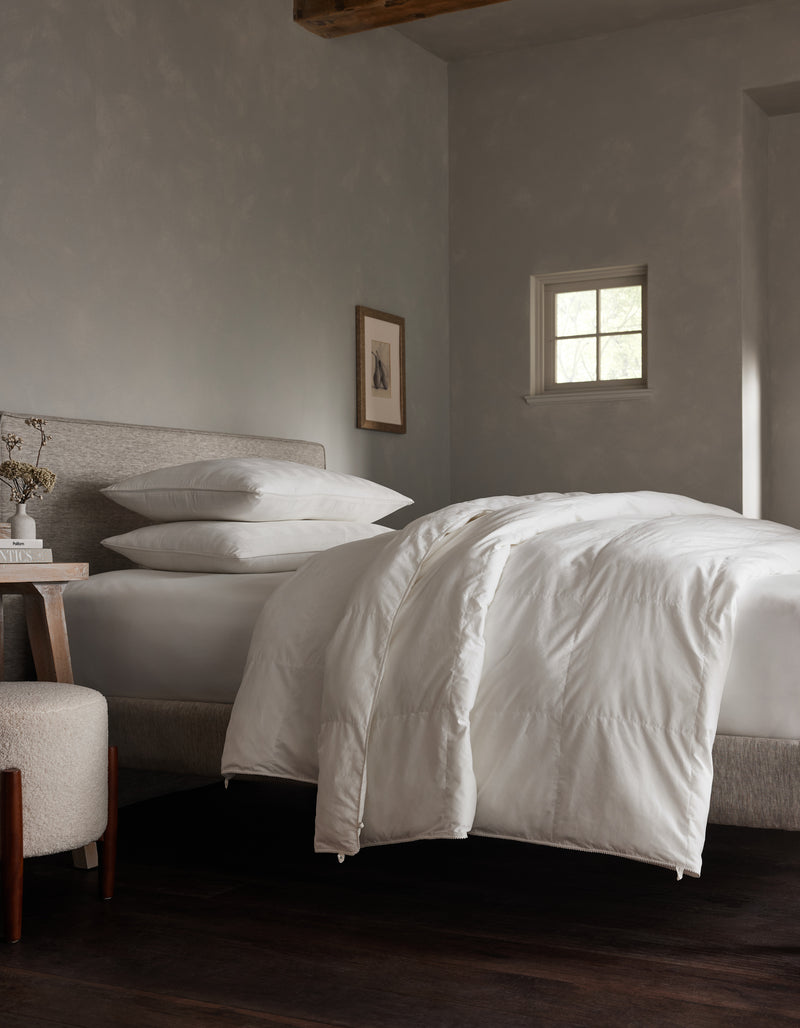 Down alternative comforter to be paired with Dove Grey, Charcoal, Creme, Driftwood, Light Grey, Oat, Pacific Blue, Shore, Peony, Walnut, Laurel, Classic Stripe in Pacific, Classic Stripe in Ebony, Classic Stripe in Laurel, White duvet cover.