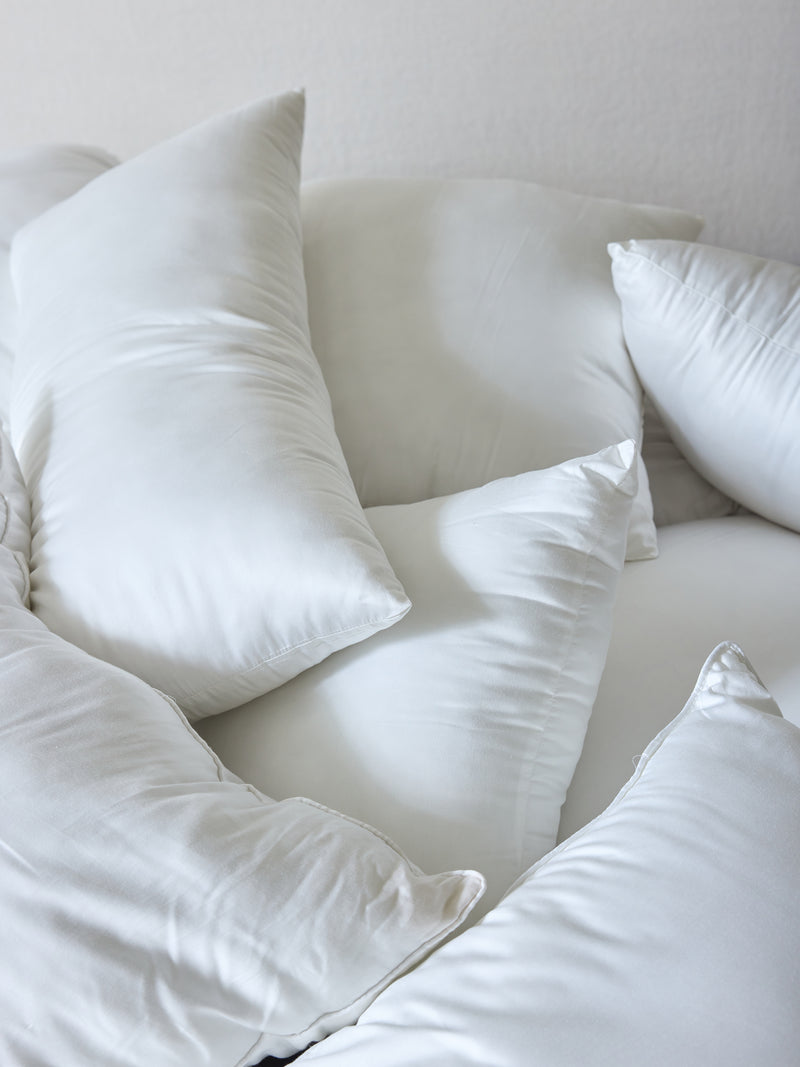 Pile of down alternative inserts