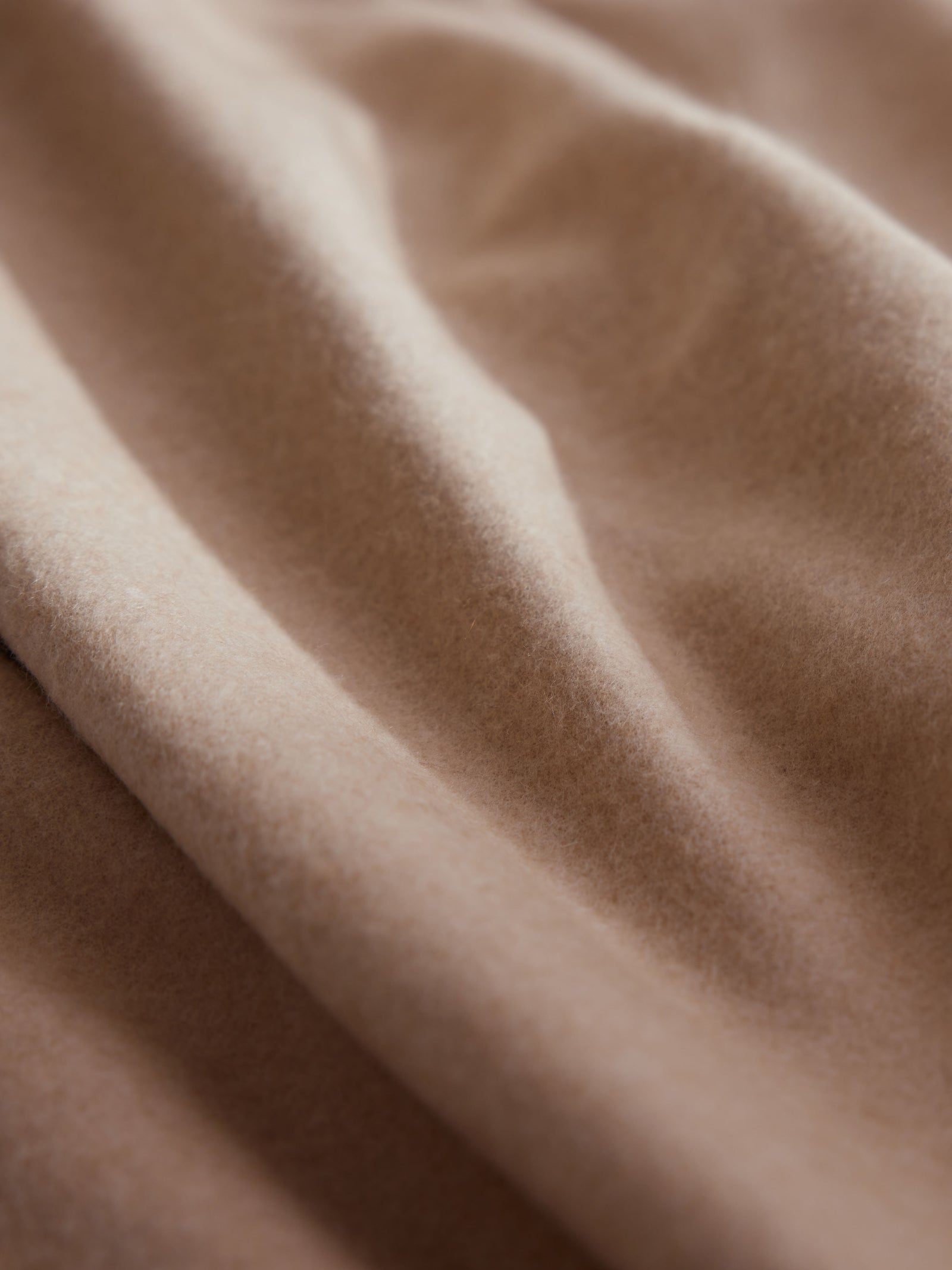 Close up of dune cashmere fabric 
