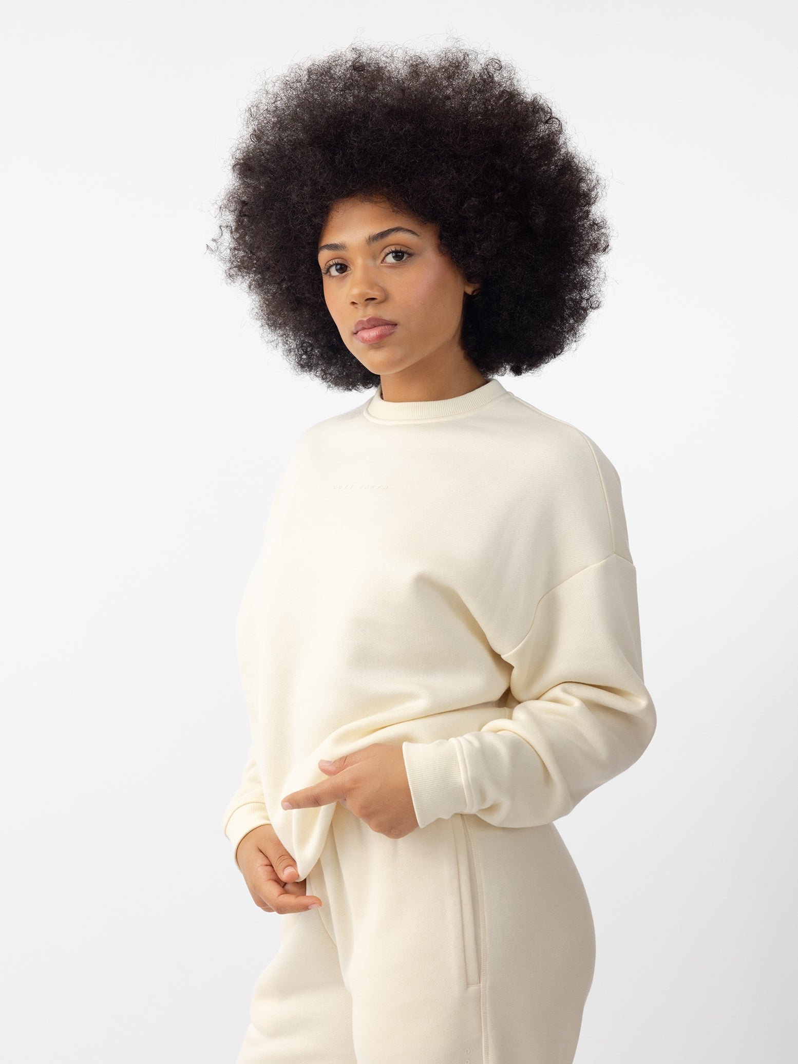 Woman wearing Alabaster CityScape Crewneck with white background 