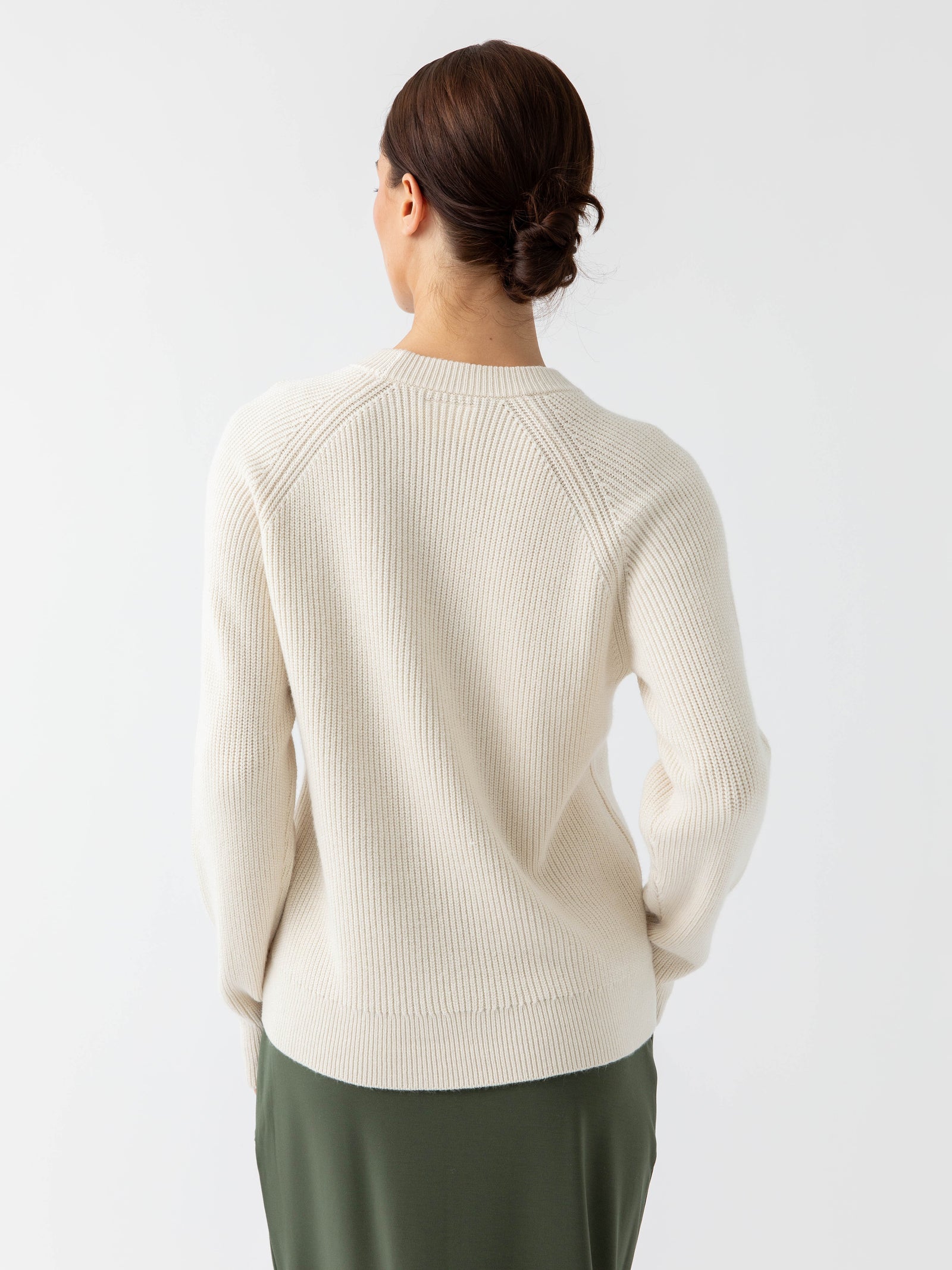 Back of woman wearing alabaster classic crewneck with white background 