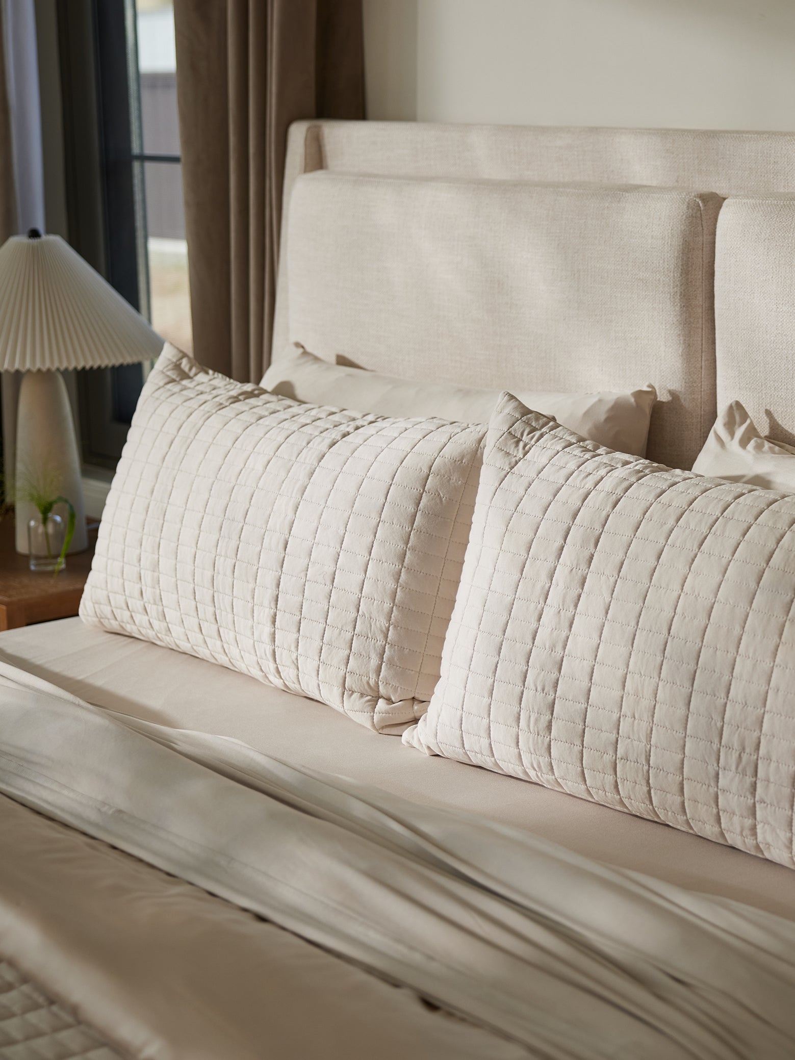 Pillows on bed with birch bamboo jersey shams 