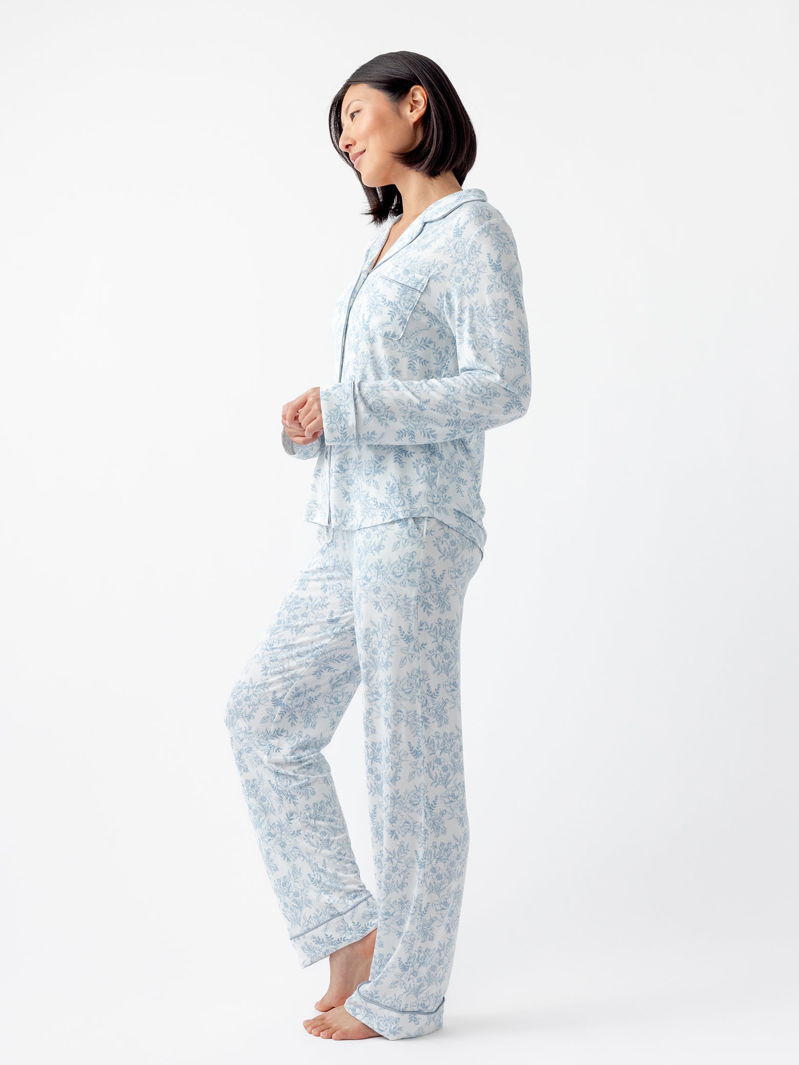 Side view of woman in blue toile pajama set 