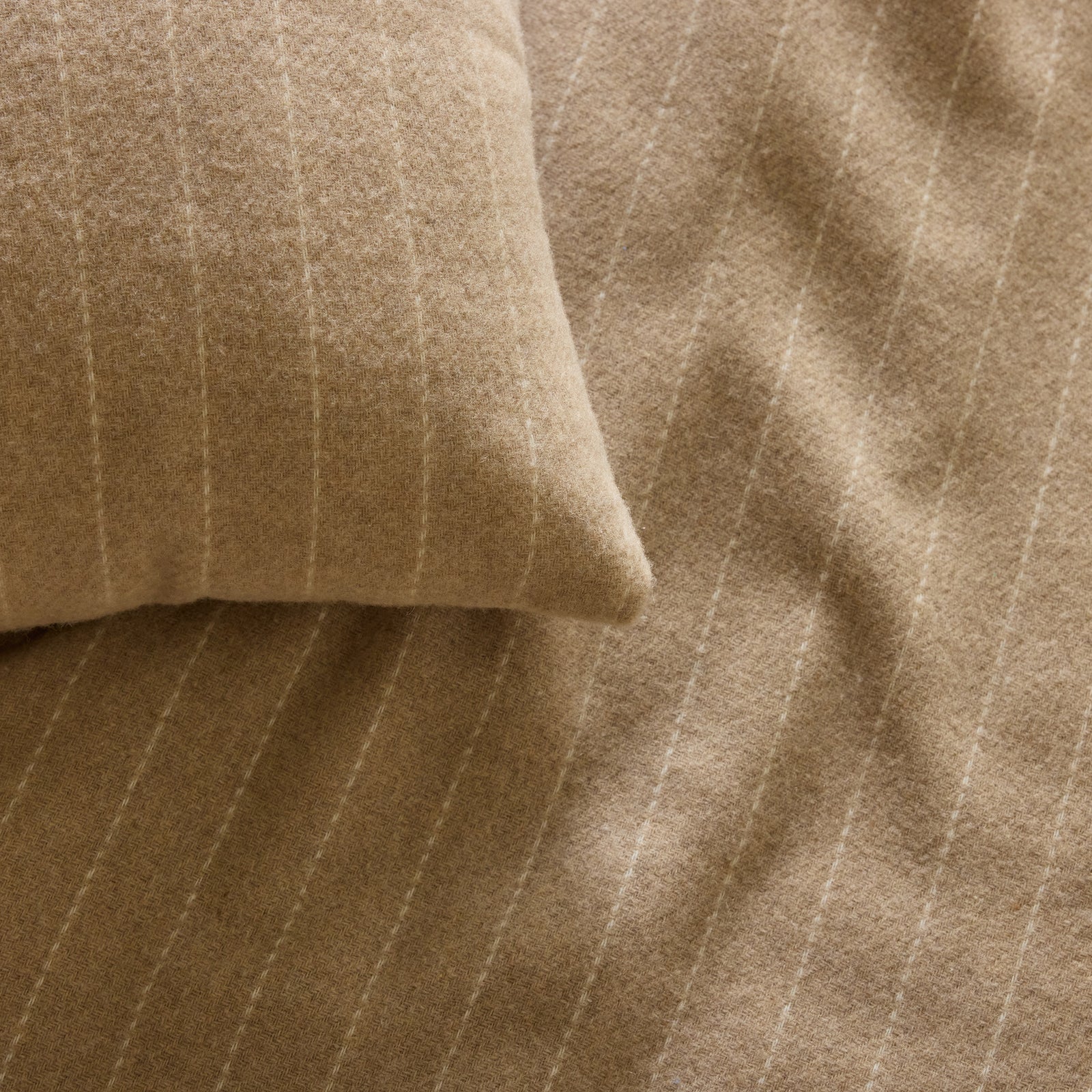 Texture shot of brandy florence pillow and blanket 