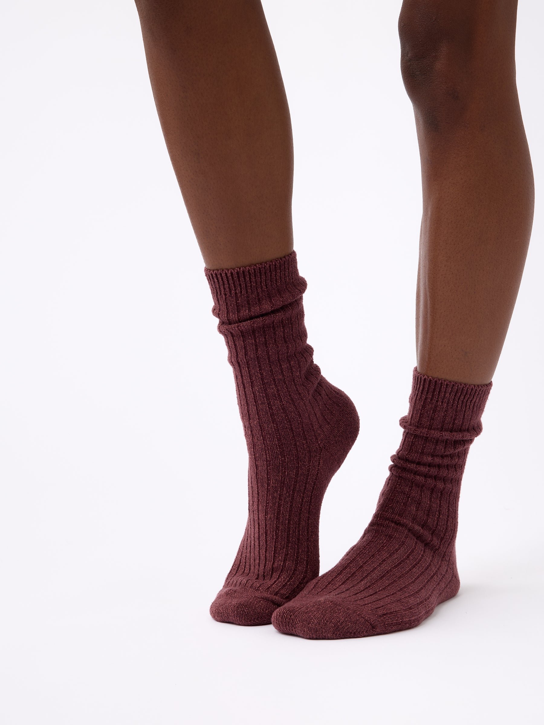 Person wearing Cozy Earth Plush Lounge Sock in Burgundy 
