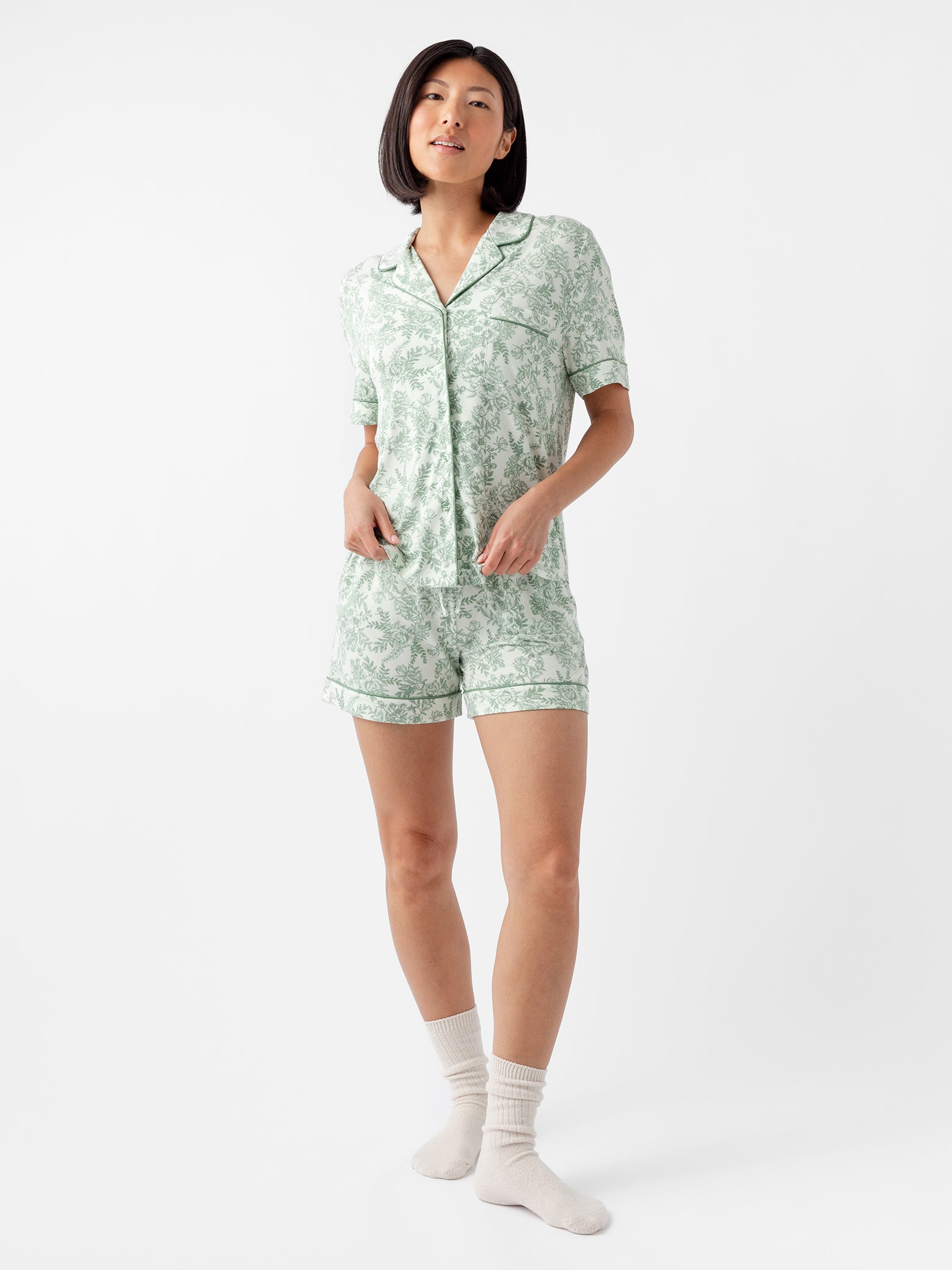 Woman wearing celadon toile short sleeve pajama set with white background 
